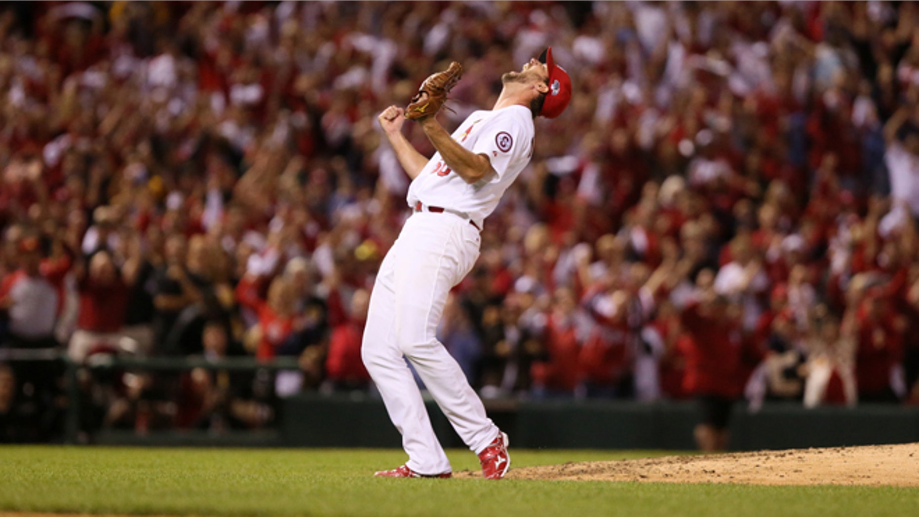 St. Louis Cardinals starting pitcher Adam Wainwright reacts after throwing a complete game shut out during Game 5 of the National League Division Series between the St. Louis Cardinals and the Pittsburgh Pirates on Wednesday, Oct. 9, 2013, at Busch Stadium in St. Louis. (AP Photo/post-dispatch.com, Chris Lee)
