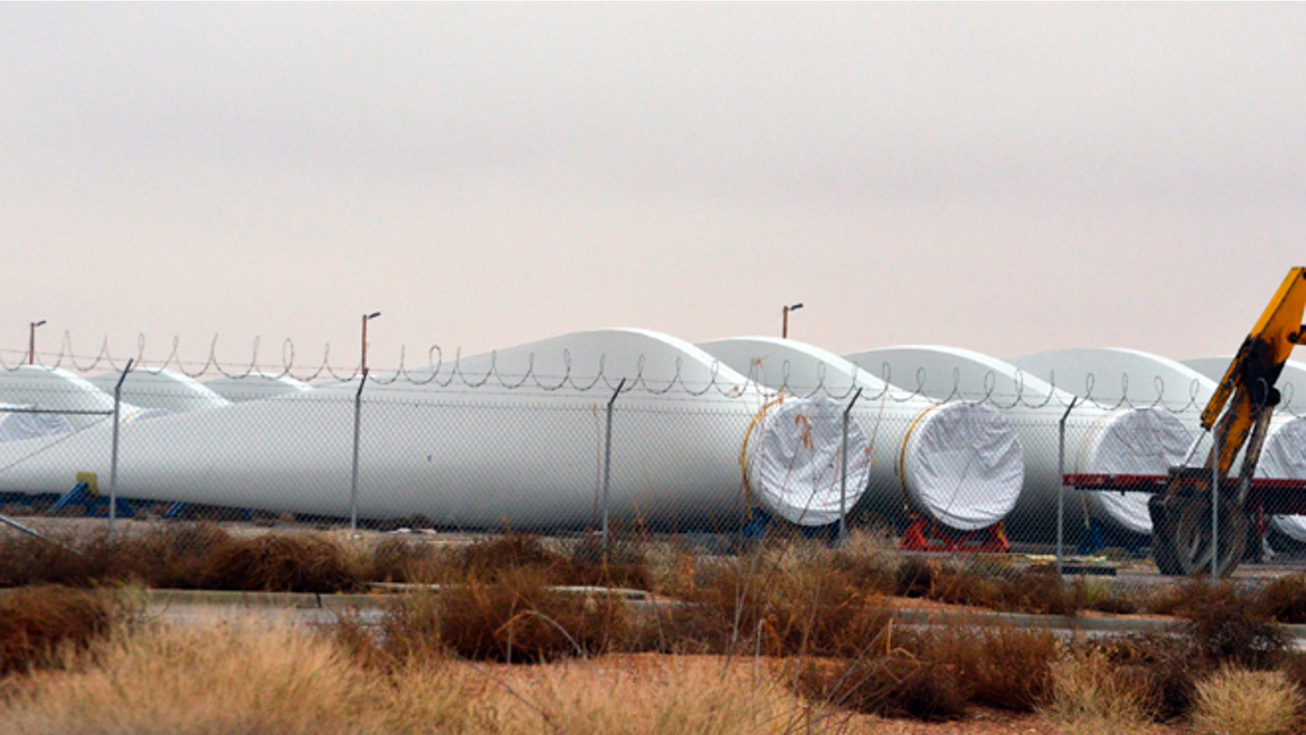 Blades for wind turbines sit in a field in the New Mexico town of Santa Teresa along the U.S.-Mexico border.