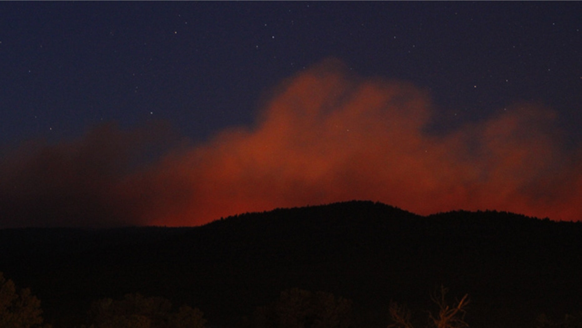 May 31, 2013: A view of the Tres Lagunas Fire from Pecos, N.M. Officials said the fire in New Mexico's Santa Fe National Forest more than doubled in size by Friday night and was still totally uncontained.