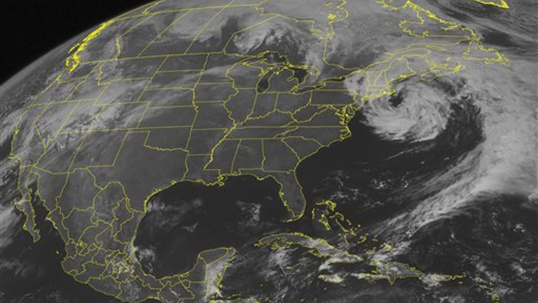 March 31, 2010: This NOAA satellite image shows mid-level clouds swirling over the Northeast and curving into the western Atlantic Ocean as a weakening low pressure system remains off the New England coast.