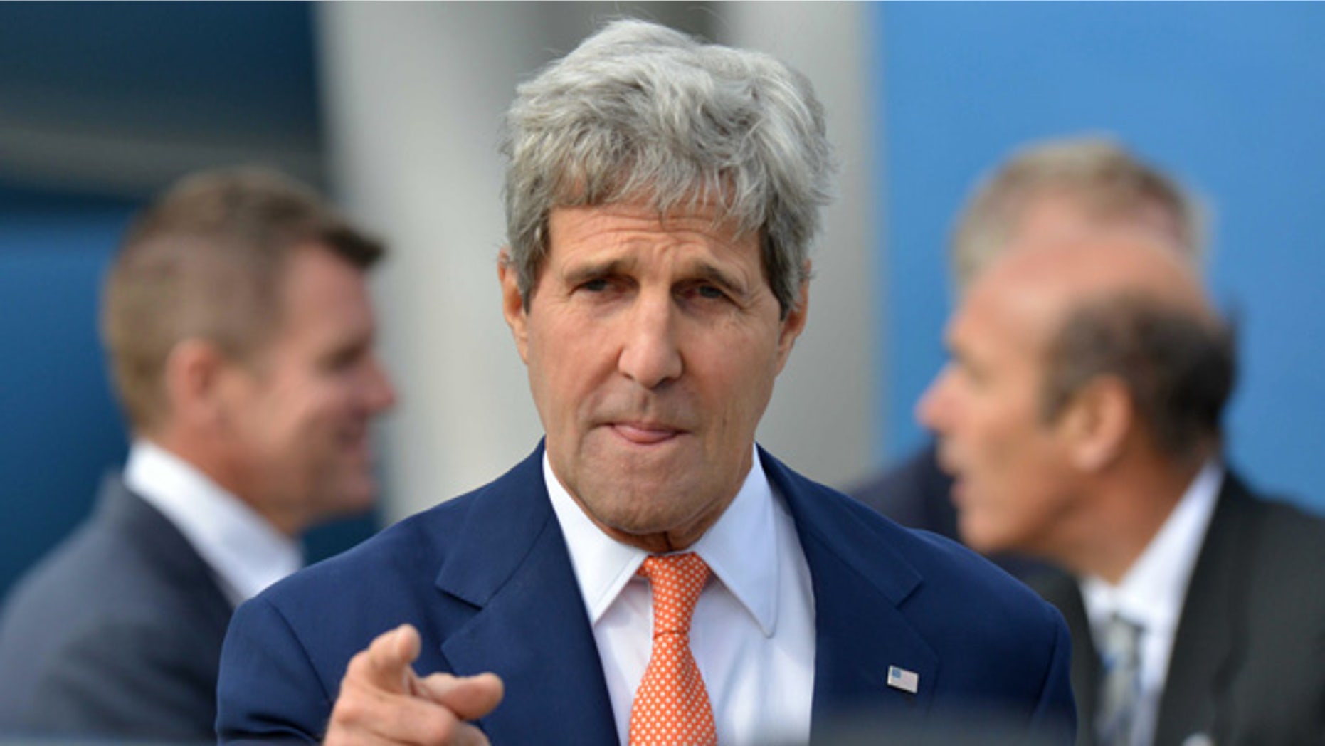 FILE - In this Monday, Aug. 11, 2014 file photo, U.S. Secretary of State John Kerry points a finger as he arrives in Sydney. In its latest personal attack on a prominent official, North Korea has called Kerry a wild dog with a 'hideous lantern jaw'. (AP Photo/Peter Parks, Pool)
