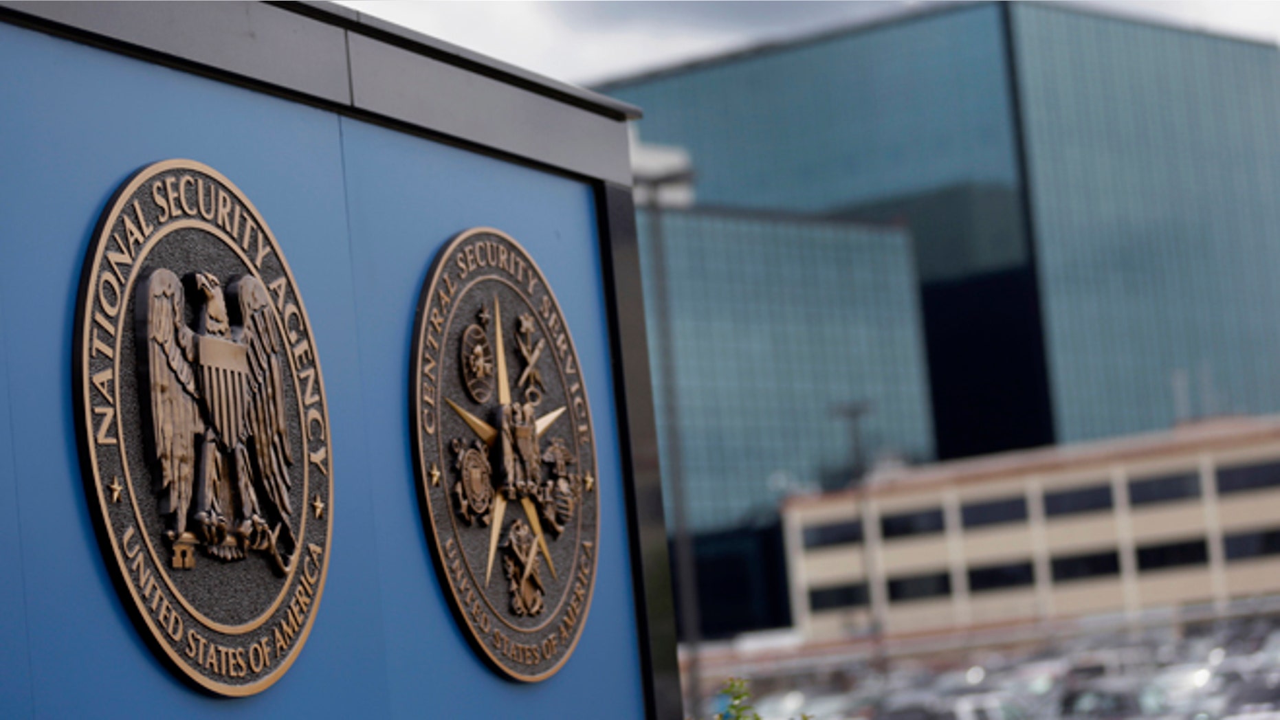 FILE - This June 6, 2013, file photo shows a sign outside the National Security Administration campus in Fort Meade, Md. Spying by the National Security Agency has cost the United States economically and angered allies, a bipartisan group of senators said Sept. 25, in unveiling legislation that would end the collection of millions of Americans' phone records and data on Internet usage. (AP Photo/Patrick Semansky, File)