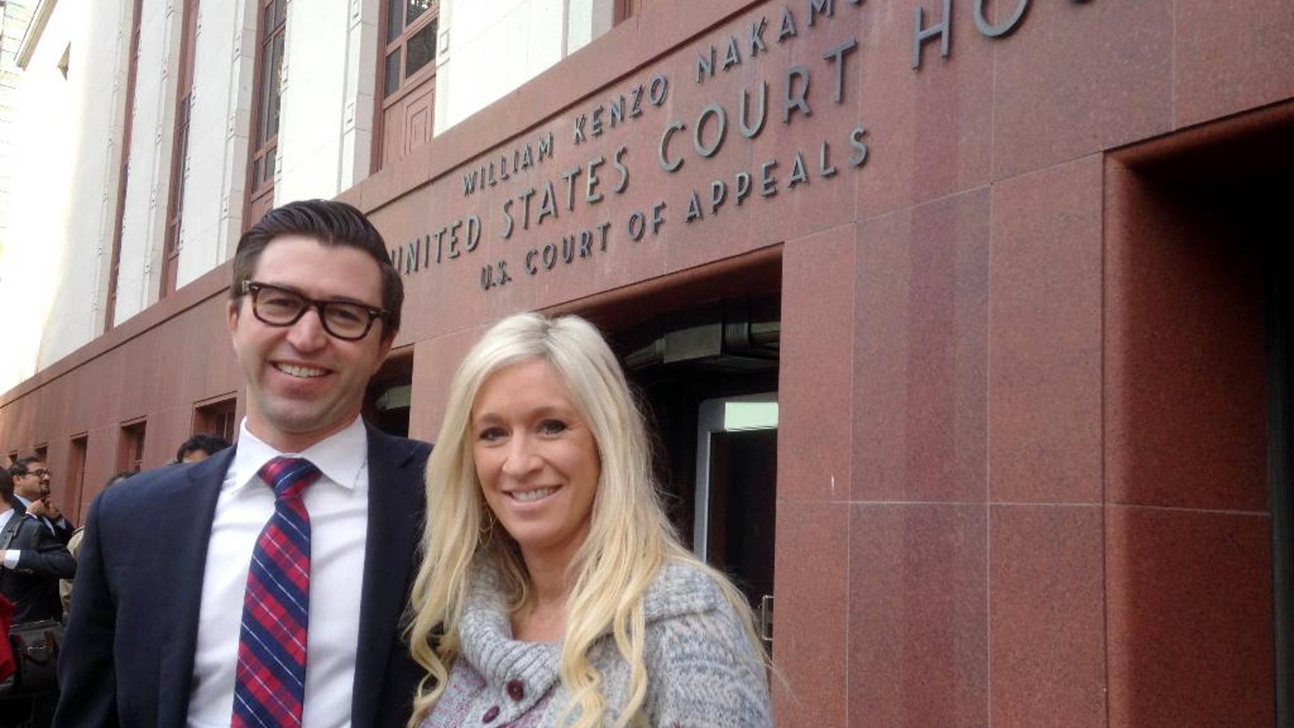 Idaho real estate attorney Peter Smith, left, and his wife, nurse Anna J. Smith, pose for a photo outside the federal appeals court building Monday, Dec. 8, 2014, in downtown Seattle. A three-judge panel of the 9th U.S. Circuit Court of Appeals heard arguments Monday in Anna Smith’s case challenging the National Security Agency’s bulk collection of Americans’ phone records; Peter Smith argued the case on her behalf. (AP Photo/Gene Johnson)