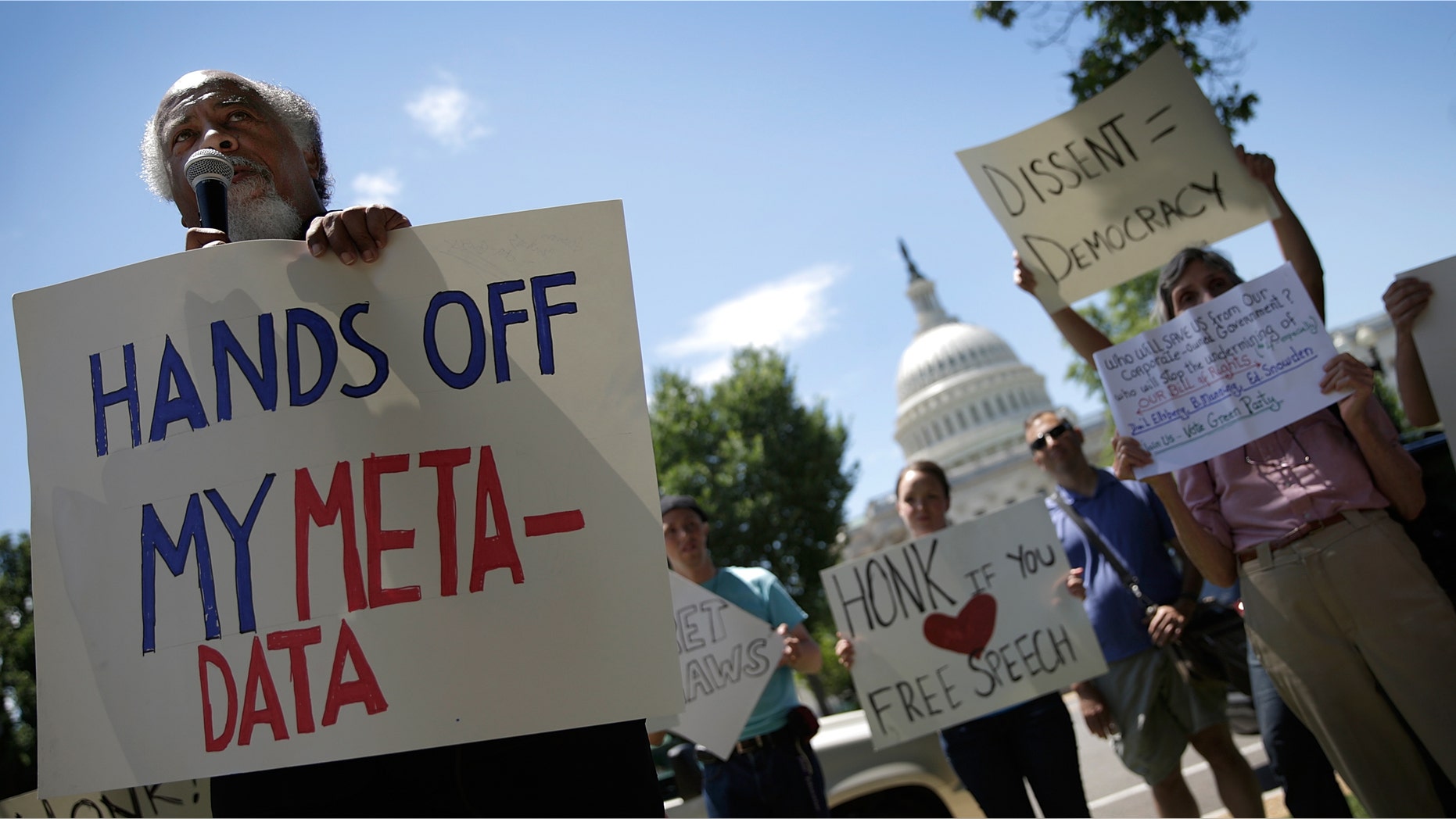 Protesters rallying outside the U.S. Capitol against the NSA's recently detailed surveillance programs June 13, 2013 in Washington, DC. (Photo by Win McNamee/Getty Images)
