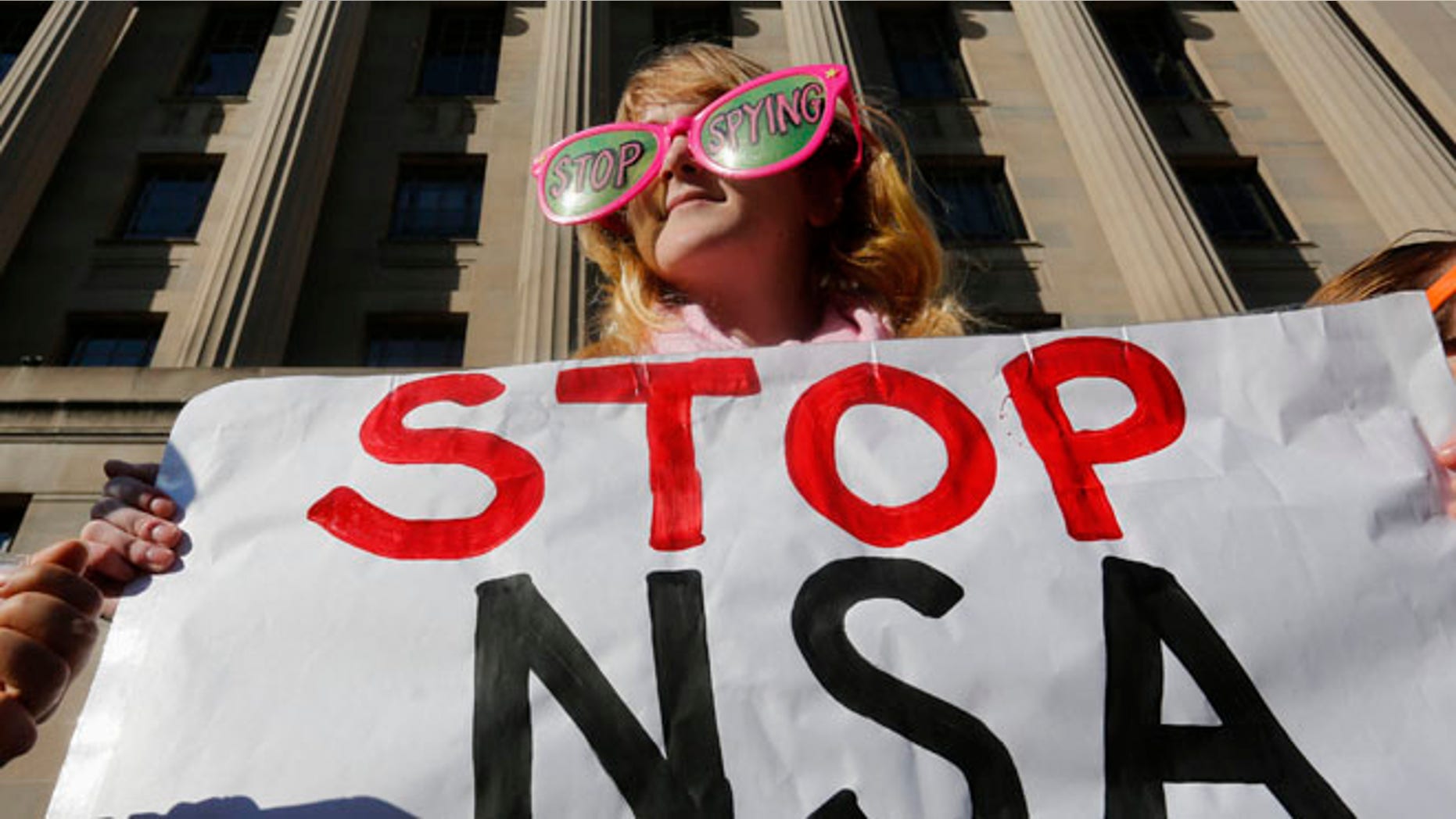 Jan. 17, 2014: Member of the protest group, Code Pink, protests against President Obama and the NSA.
