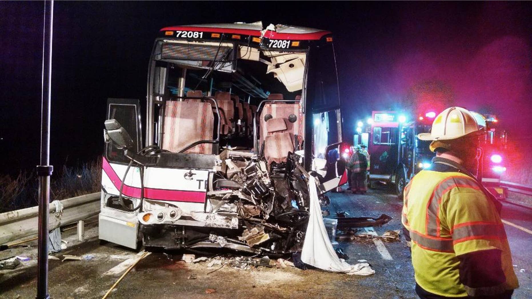 This photo provided by the Onondaga County Sheriff's Office shows the bus involved in a crash with a tractor-trailer and a car that left 27 people injured on Interstate 81 early Thursday, Nov. 6, 2014, in Nedrow, N.Y. Twenty-six passengers suffered minor injuries on the Pine Hills Trailways bus traveling from Toronto to New York City. The bus driver is in serious condition at a Syracuse hospital. Police say the car driver has been charged with driving while intoxicated. (AP Photo/Onondaga County Sheriff's Office)