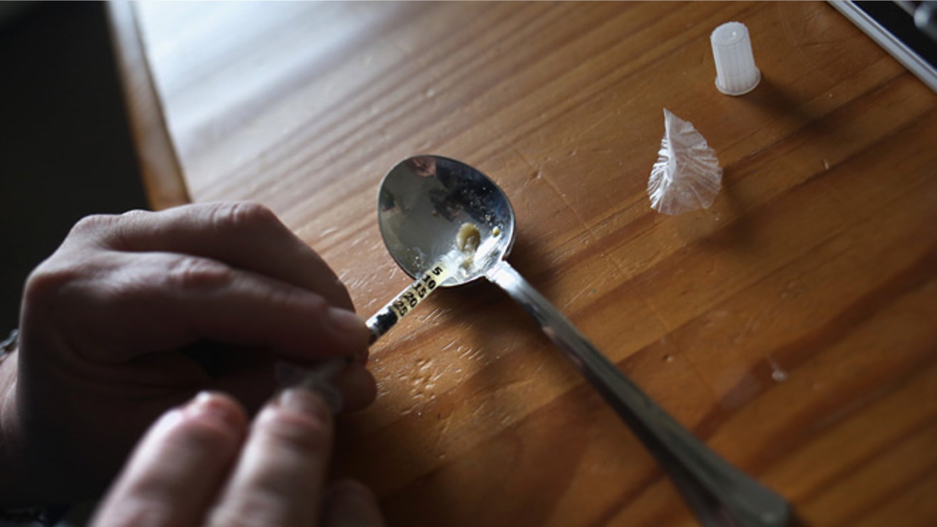 NEW LONDON, CT - MARCH 23: A heroin user prepares to inject himself on March 23, 2016 in New London, CT. Communities nationwide are struggling with the unprecidented heroin and opioid pain pill epidemic. On March 15, the U.S. Centers for Disease Control (CDC), announced guidelines for doctors to reduce the amount of opioid painkillers prescribed nationwide, in an effort to curb the epidemic. The CDC estimates that most new heroin addicts first became hooked on prescription pain medication before graduating to heroin, which is stronger and cheaper. (Photo by John Moore/Getty Images)