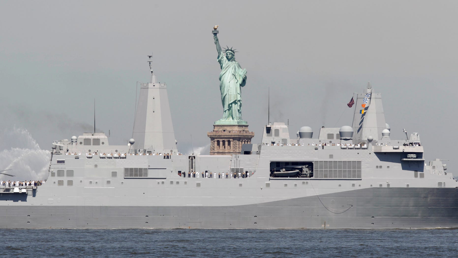 Sailors stand on the deck as the USS New York passes the Statue of Liberty to kick off Fleet Week in New York, Wednesday, May 25, 2011. Fleet Week ends on Memorial Day with a military flyover honoring American military personnel who lost their lives in service.