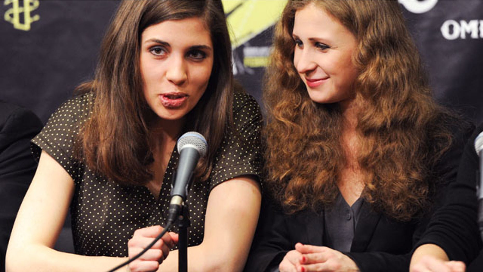 FILE - In this Feb. 5, 2014 file photo, Nadezhda "Nadya" Tolokonnikova, left, and Maria "Masha" Alekhina of Pussy Riot, participate in a press conference for Amnesty International's "Bringing Human Rights Home" concert at the Barclays Center in New York. (AP)