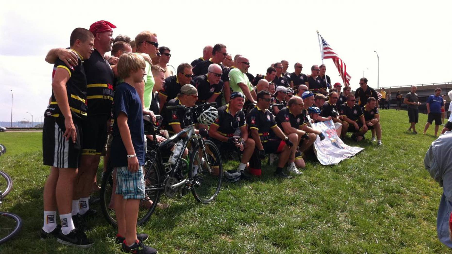 New York firefighters who biked to the Pentagon for Sunday's 9/11 anniversary pose for a picture. (Fox News Photo/Justin Fishel)