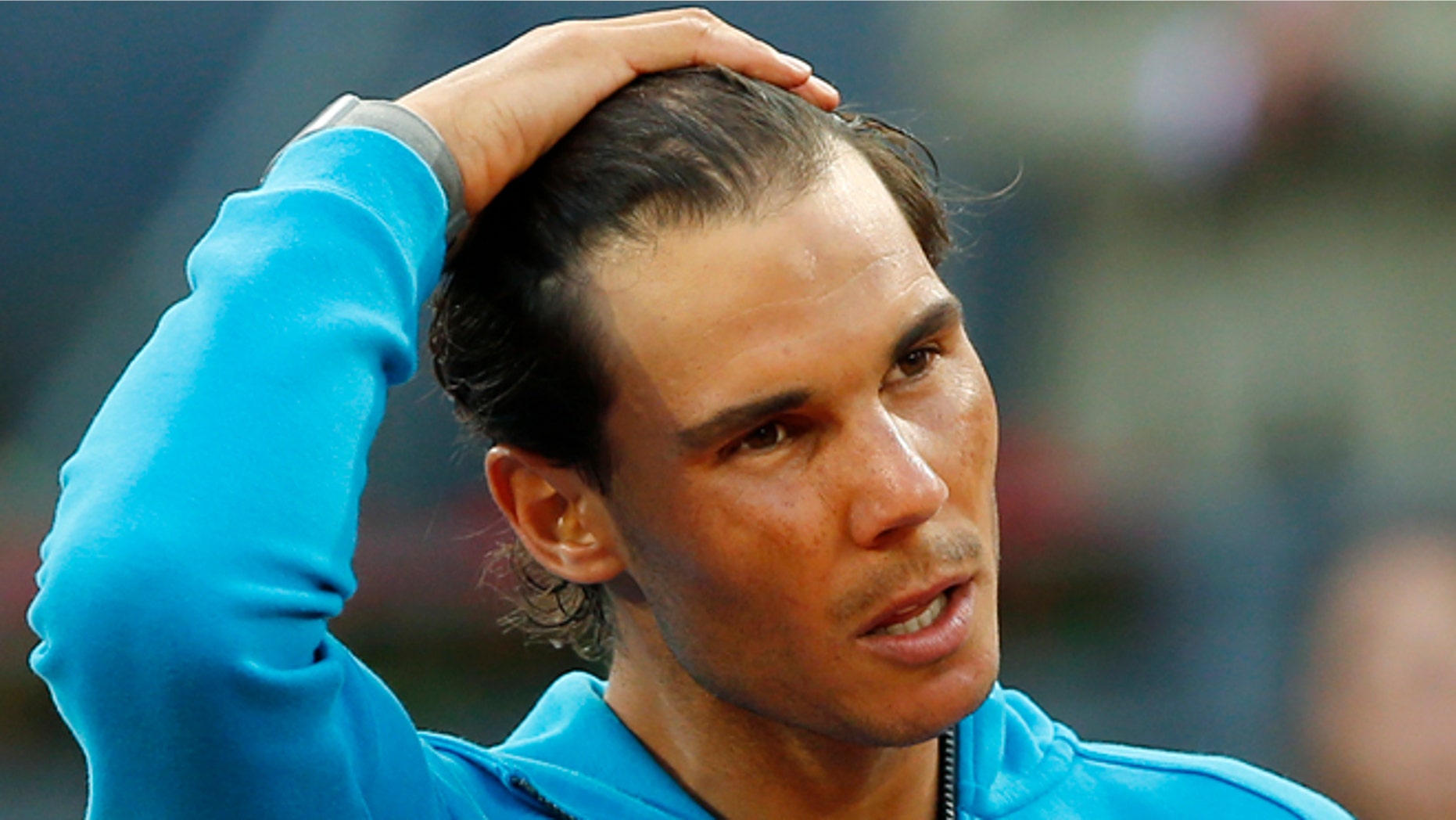 Rafael Nadal of Spain makes a speech after losing to Andy Murray of Britain during the men's final at the Madrid Open Tennis tournament in Madrid, Spain, Sunday, May 10, 2015. (AP Photo/Paul White)