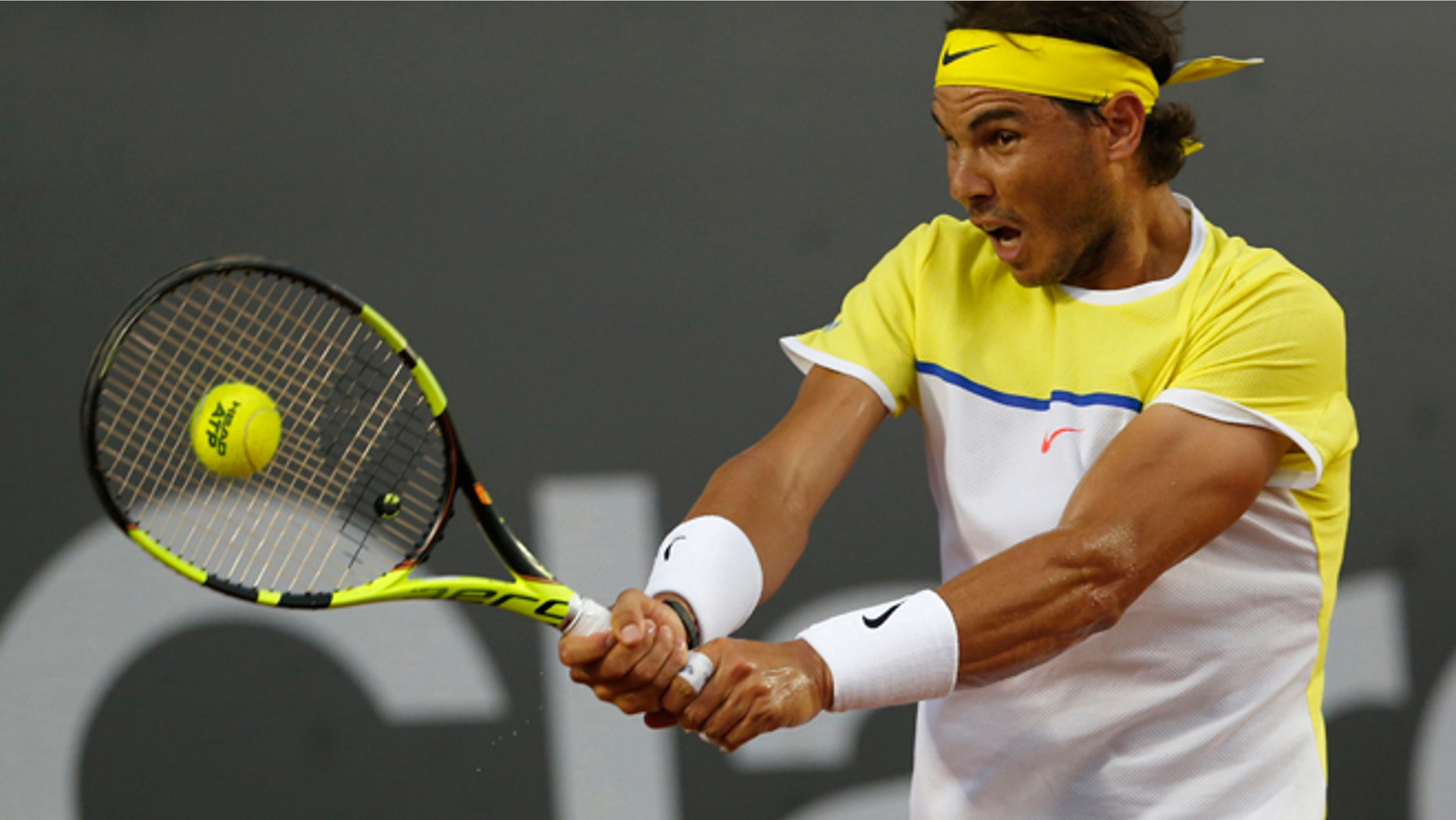 Rafael Nadal of Spain returns the ball to Nicolas Almagro of Spain, during a Rio Open tennis match, in Rio de Janeiro, Brazil, Thursday, Feb. 18, 2016. (AP Photo/Silvia Izquierdo)