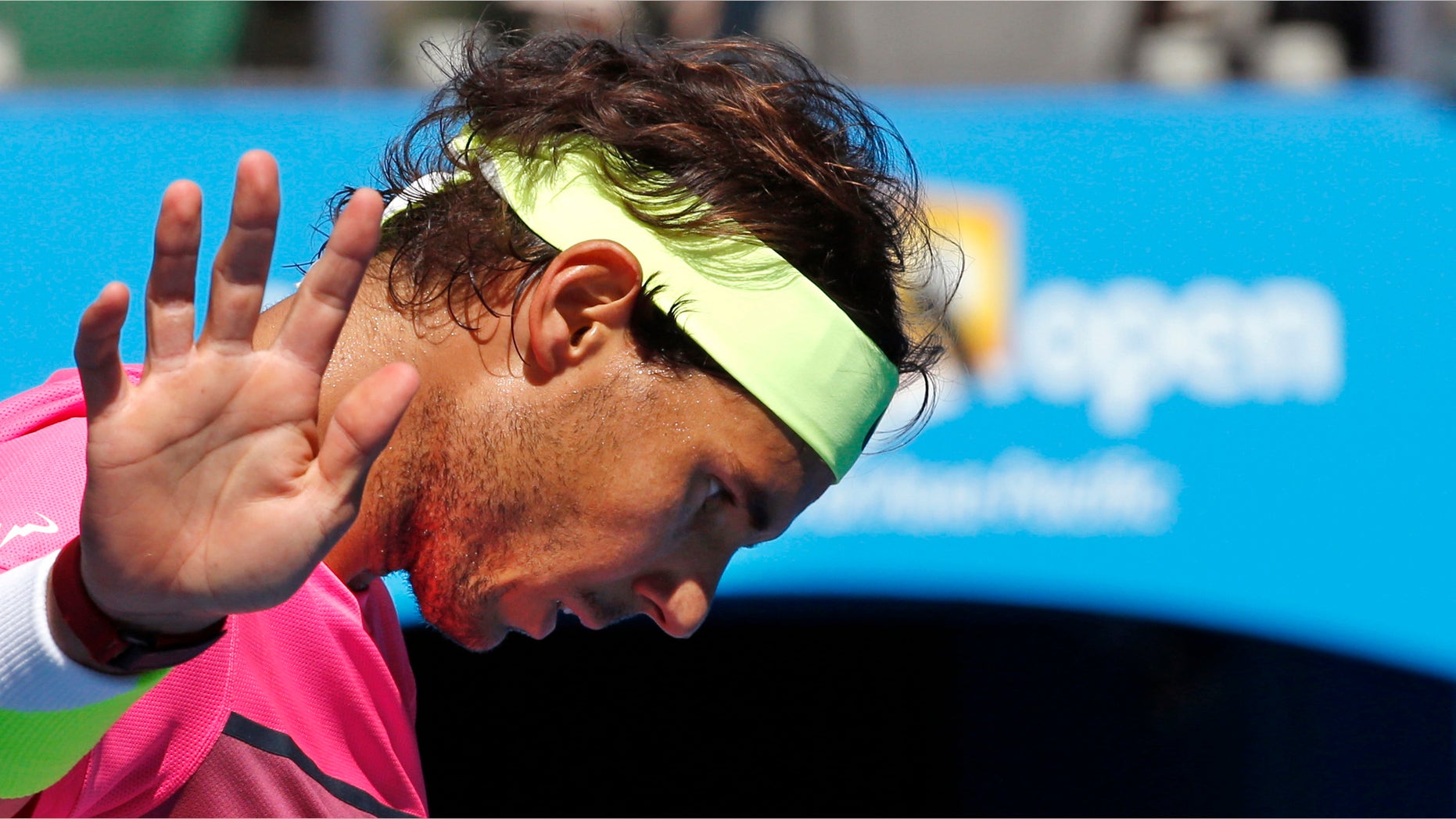 Rafael Nadal of Spain gestures as he plays Kevin Anderson of South Africa during their fourth round match at the Australian Open tennis championship in Melbourne, Australia, Sunday, Jan. 25, 2015. (AP Photo/Vincent Thian)