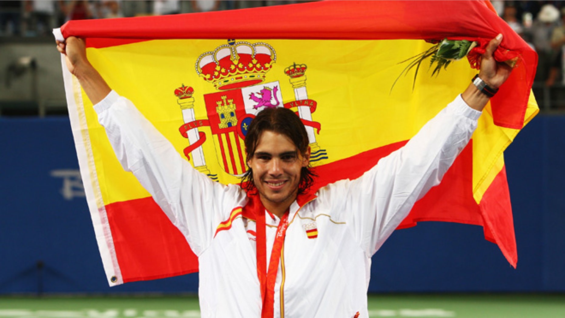 BEIJING - AUGUST 17: Rafael Nadal of Spain celebrates winning the gold medal against Fernando Gonzalez of Chile during the men's singles gold medal tennis match held at the Olympic Green Tennis Center during Day 9 of the Beijing 2008 Olympic Games on August 17, 2008 in Beijing, China. (Photo by Clive Brunskill/Getty Images)