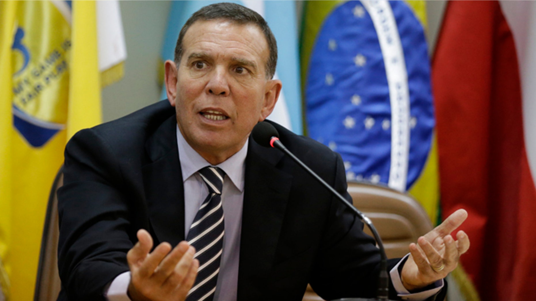 FILE - In this May 21, 2015 file photo, CONMEBOL President Juan Angel Napout talks during a press conference in Asuncion, Paraguay. Napout was arrested on Thursday, Dec. 3, 2015, in a pre-dawn raid at a luxury hotel in Switzerland as part of the U.S. Department of Justice's widening bribery case that has shaken world soccer's scandal-hit governing body, FIFA. The Swiss justice ministry says, Napout who is also a FIFA vice president, is opposing his extradition to the U.S. (AP Photo/Jorge Saenz, File)