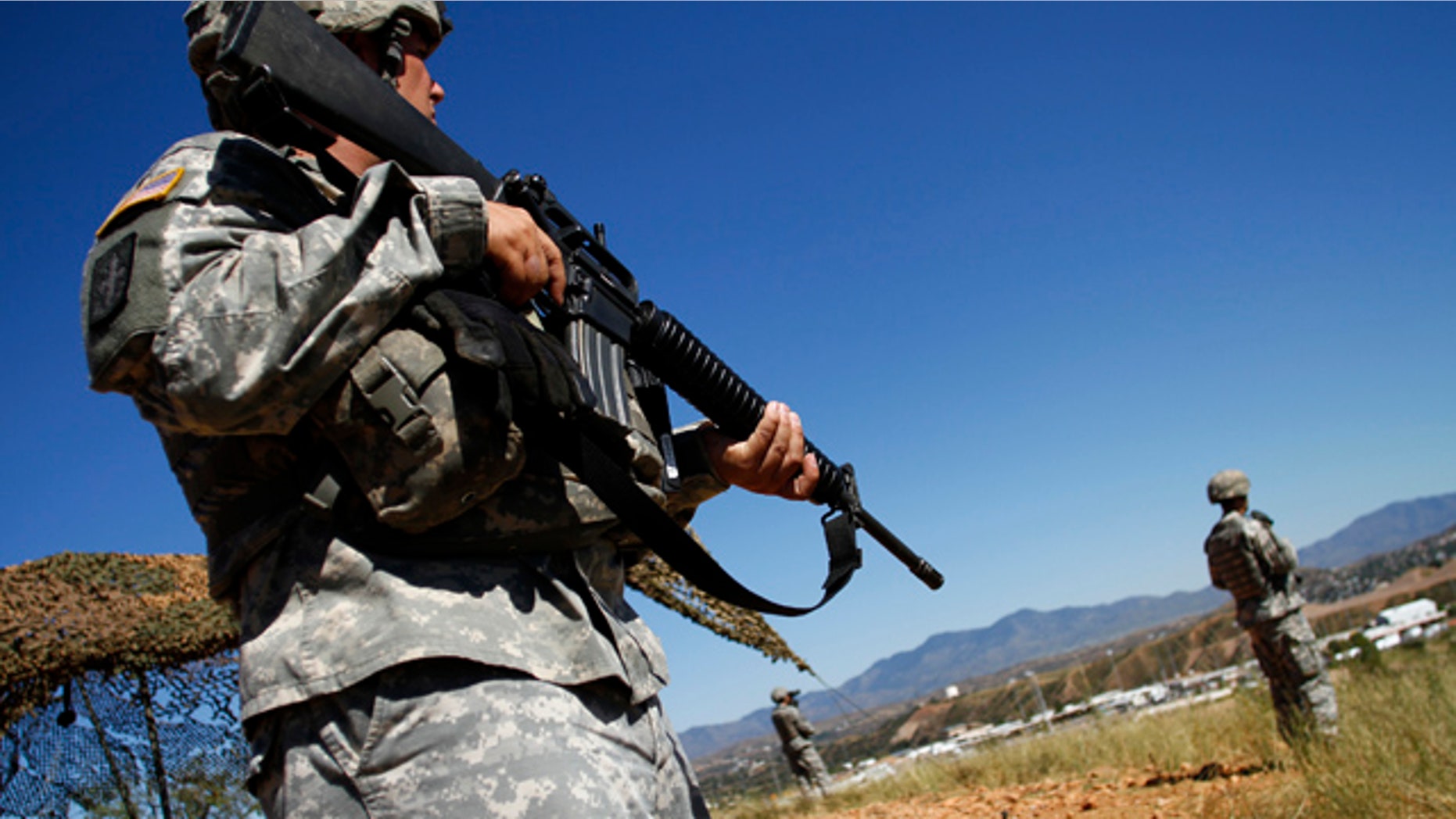 Oct. 8, 2010: National Guard troops patrol along the U.S. and Mexico border in Nogales, Ariz.