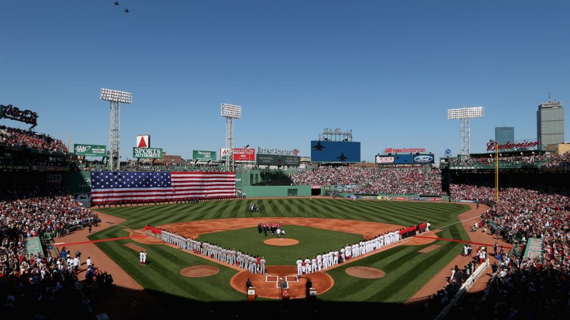 BOSTON, MA - APRIL 13: General view as the Boston Red Sox and the Washington Nationals stand on the field for the National Anthem before the game at Fenway Park on April 13, 2015 in Boston, Massachusetts. (Photo by Maddie Meyer/Getty Images)