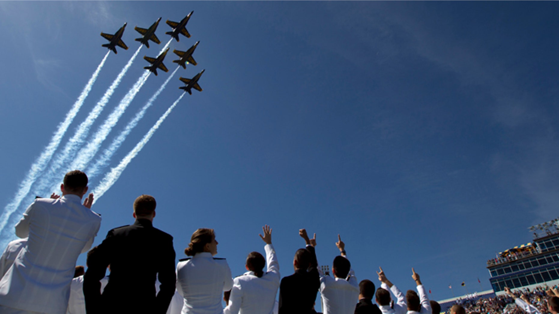May 23, 2014: U.S. Navy flight demonstration team, The Blue Angels perform a flyover above graduating Midshipmen during the United States Naval Academy 2014 Class graduation and commissioning ceremonies at Navy-Marine Corps Stadium in Annapolis, Md. (AP)