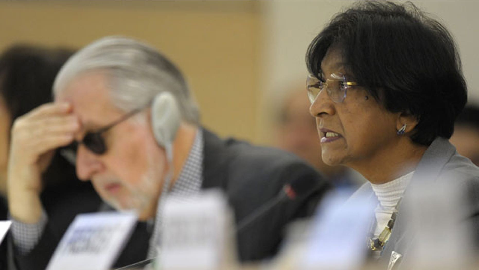 December 2, 2011: UN High Commissioner for Human Rights, South African Navanethem Pillay, right, delivers her statement next to Brazilian Paulo Pinheiro, left, Chairperson of the independent Commission of Inquiry on Syria to Human Rights Council, during the Human Rights Council Special Session on the human rights situation in the Syrian Arab Republic.