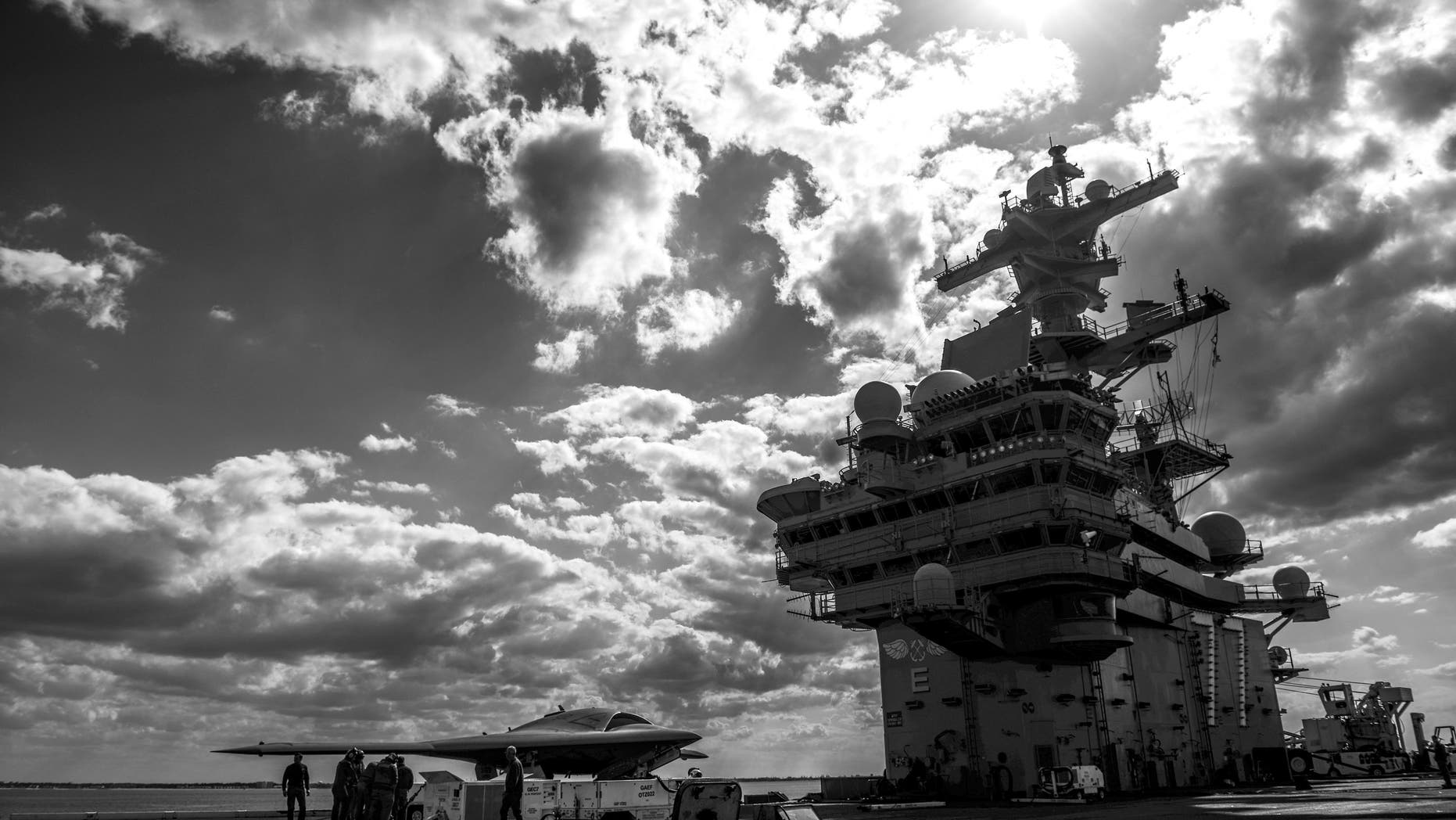 ATLANTIC OCEAN - MAY 13: In this handout released by the U.S. Navy, Northrop Grumman personnel conduct pre-operational tests on an X-47B Unmanned Combat Air System (UCAS) demonstrator on the flight deck of the aircraft carrier USS George H.W. Bush (CVN 77) May 13, 2013 in the Atlantic Ocean. George H.W. Bush is scheduled to be the first aircraft carrier to catapult-launch an unmanned aircraft from its flight deck. The Navy plans to have unmanned aircraft on each of its carriers to be used for surveillance and be armed and used in combat roles. (Photo by Mass Communication Specialist 3rd Class Kevin J. Steinberg//U.S. Navy via Getty Images)