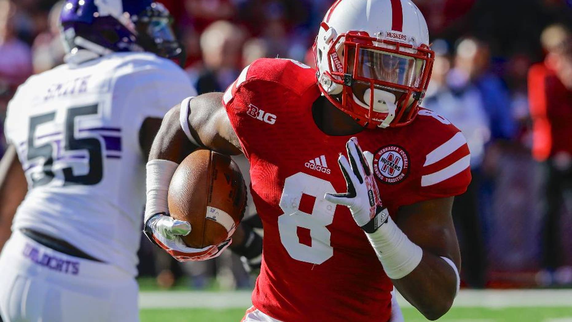 FILE - In this Nov. 2, 2013, file photo, Nebraska running back Ameer Abdullah (8) runs with the ball in the first half of an NCAA college football game against Northwestern in Lincoln, Neb. At a school that has a tradition of producing great running backs, Nebraska's Abdullah already is one of the greatest. (AP Photo/Nati Harnik, FIle)
