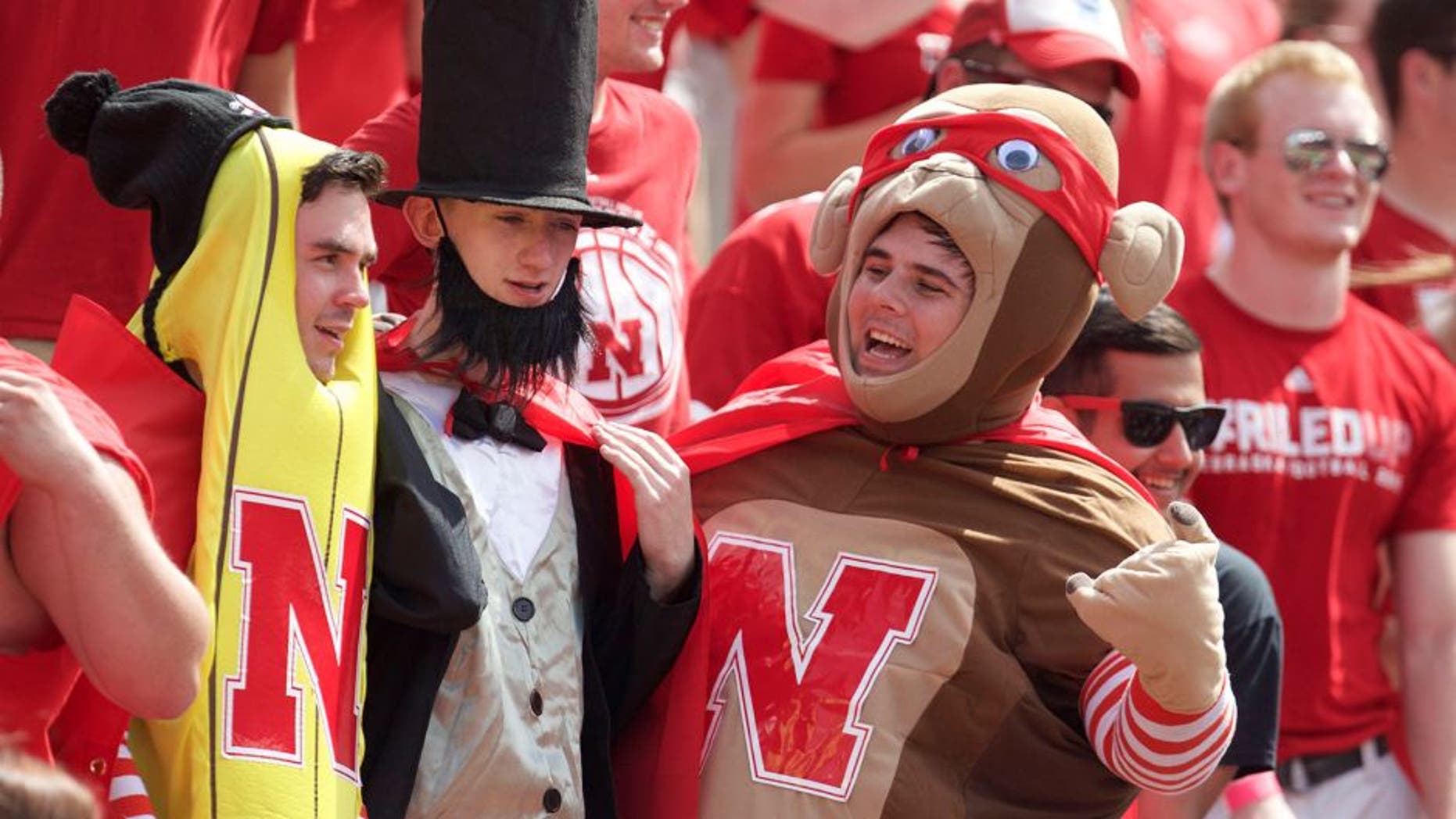 Sep 5, 2015; Lincoln, NE, USA; Nebraska Cornhuskers fans cheer from the stands against the Brigham Young Cougars in the first half at Memorial Stadium. Mandatory Credit: Bruce Thorson-USA TODAY Sports