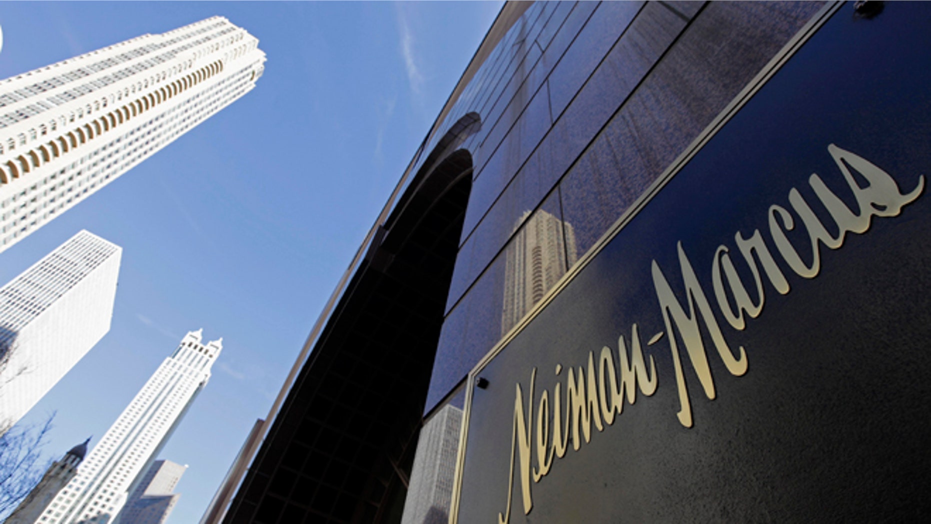 The Chicago skyline is reflected in the exterior of Neiman Marcus on Michigan Avenue.