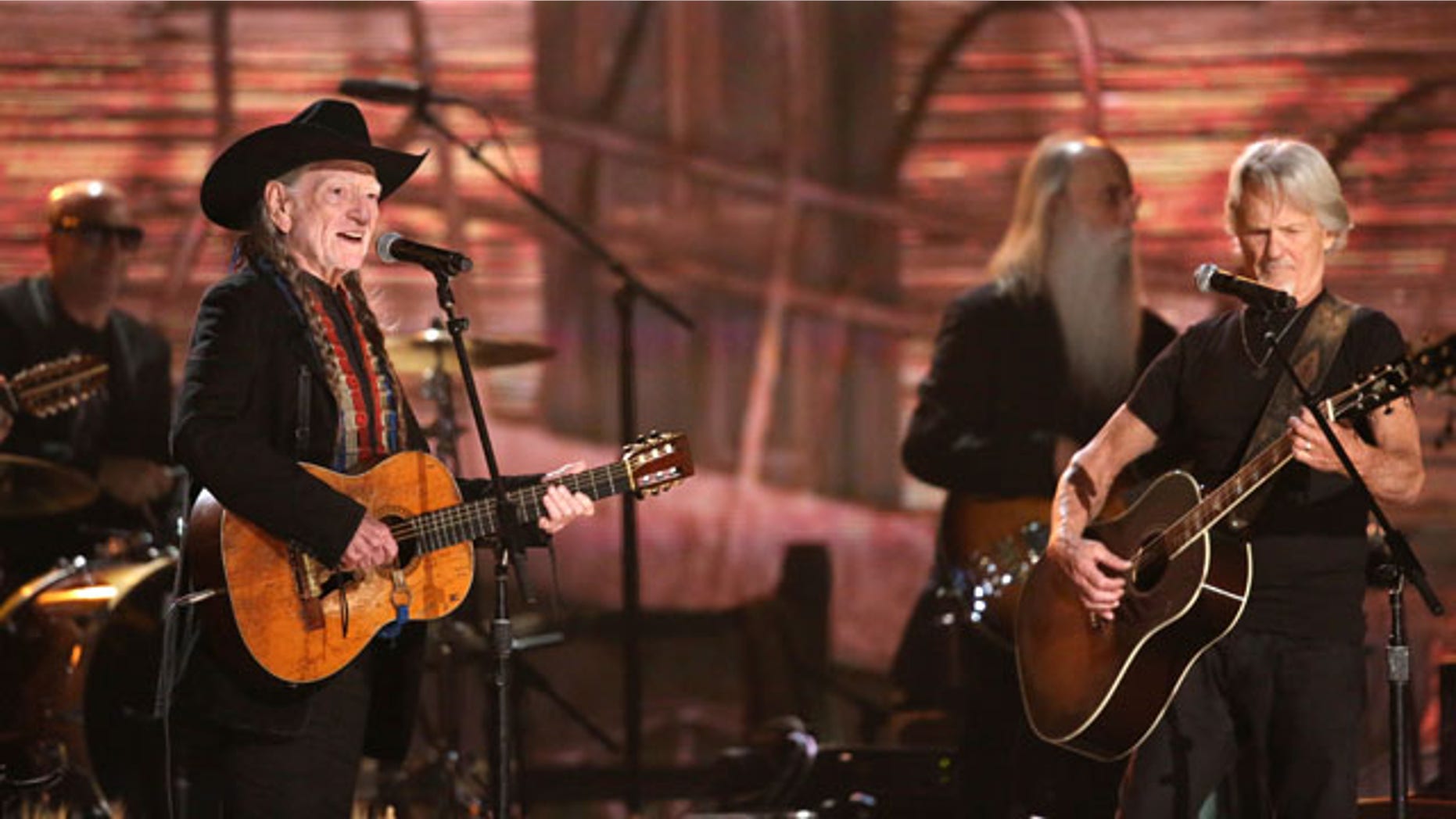 January 26, 2014: Willie Nelson, left, and Kris Kristofferson perform on stage at the 56th annual Grammy Awards at Staples Center in Los Angeles. (Photo by Matt Sayles/Invision/AP)