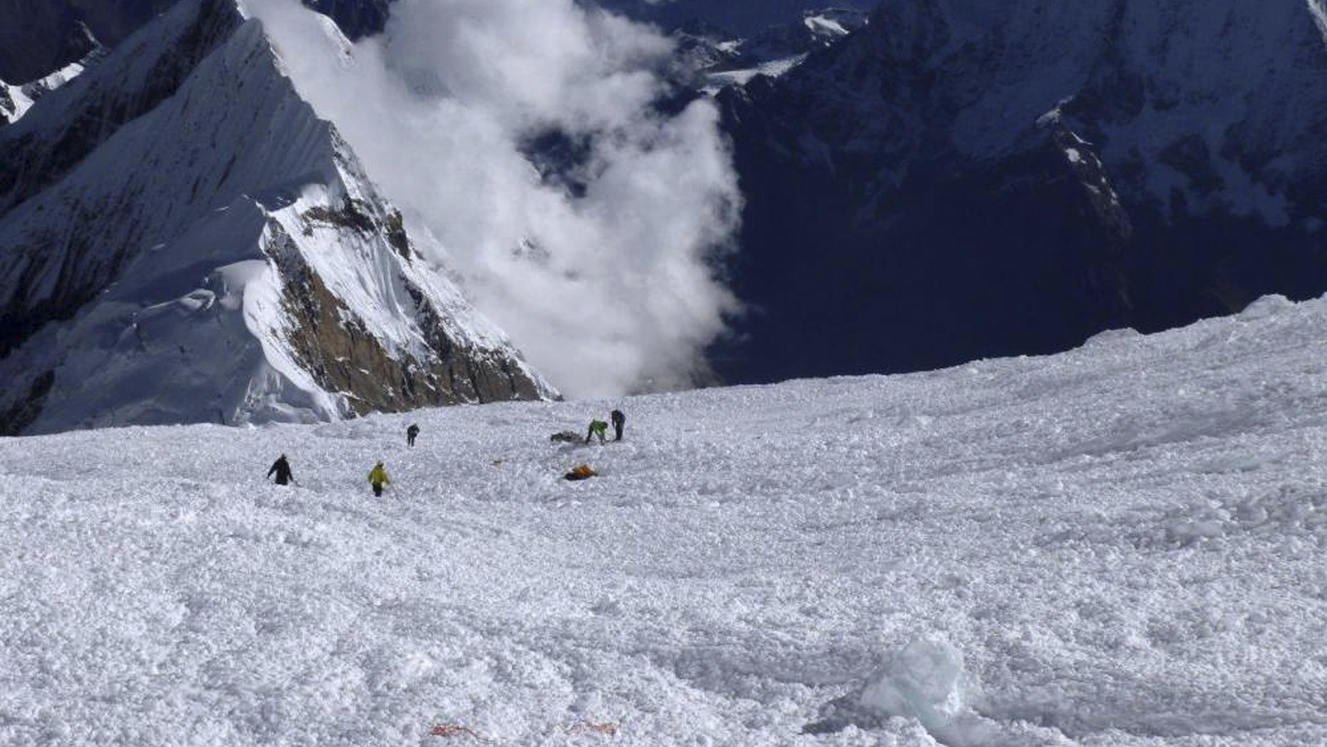 Sept. 23, 2012: In this picture released by Alpine Ascents International, rescuers search for survivors and victims in the debris field of an avalanche on Mount Manaslu in northern Nepal.