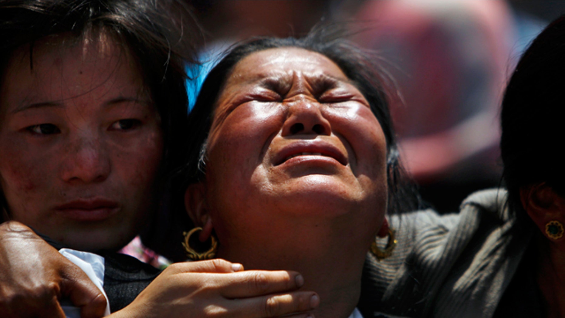 April 21, 2014: Relatives of mountaineers killed in an avalanche on Mount Everest cry during the funeral ceremony in Katmandu, Nepal.
