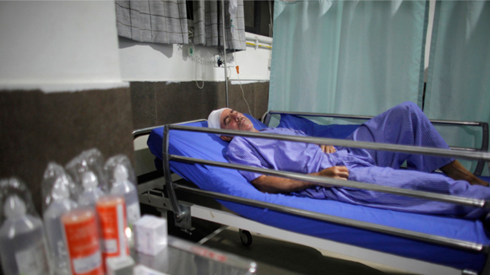 Spanish trekker Juan Mari Eguillor, 68, who survived a landslide receives treatment at Vayodha Hospital in Kathmandu, Nepal, Thursday, Sept. 22, 2016. A Spanish trekker and three Nepalese guides were killed Thursday and more than a dozen injured when they were hit by a landslide triggered by heavy rain in Nepal's northern mountains, officials said.(AP Photo/Niranjan Shrestha)