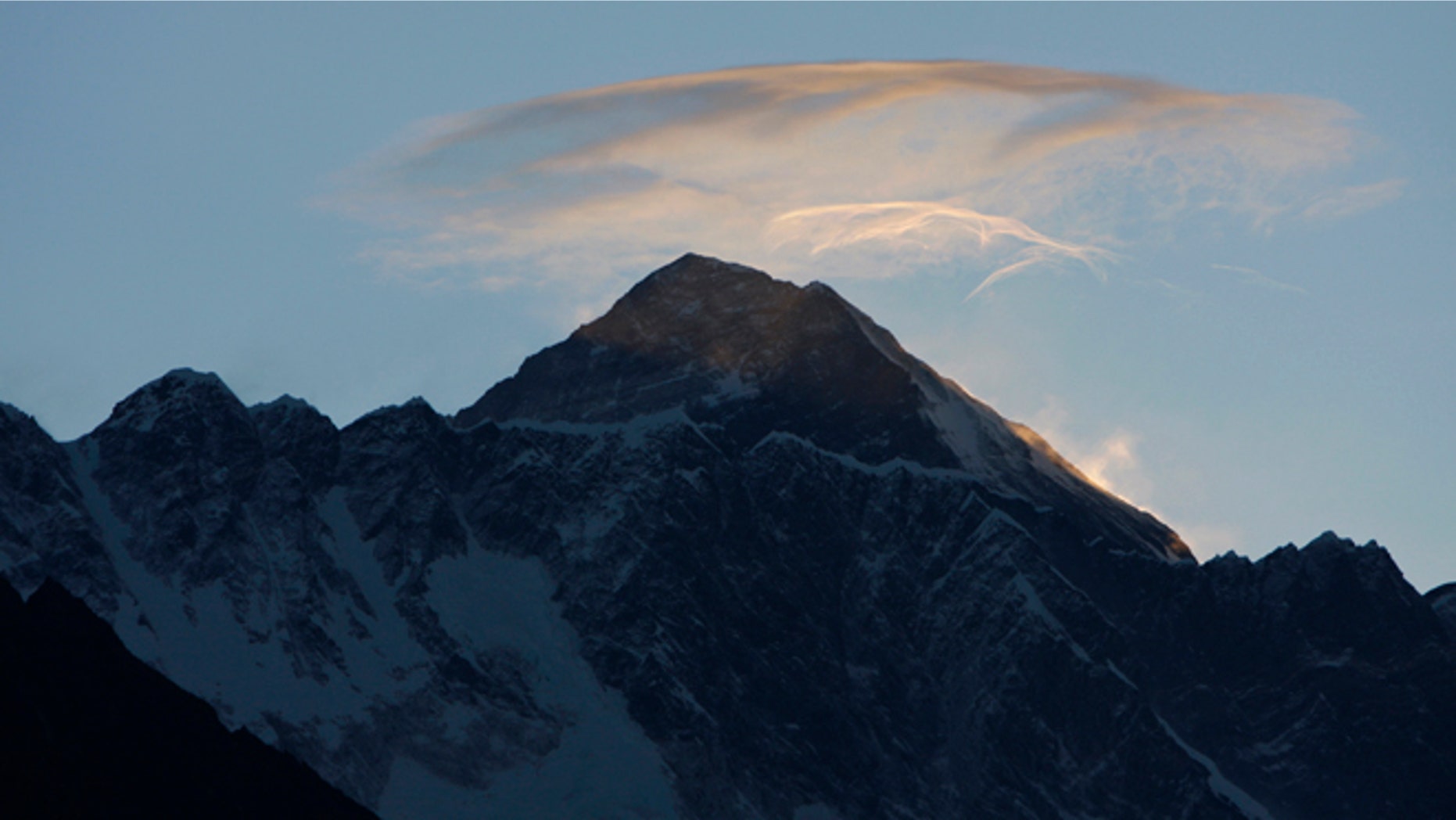 May 19, 2010: Clouds hover above the world's highest peak Mount Everest, as seen from Syangboche, about 125 kilometers (80 miles) northeast of Katmandu, Nepal.
