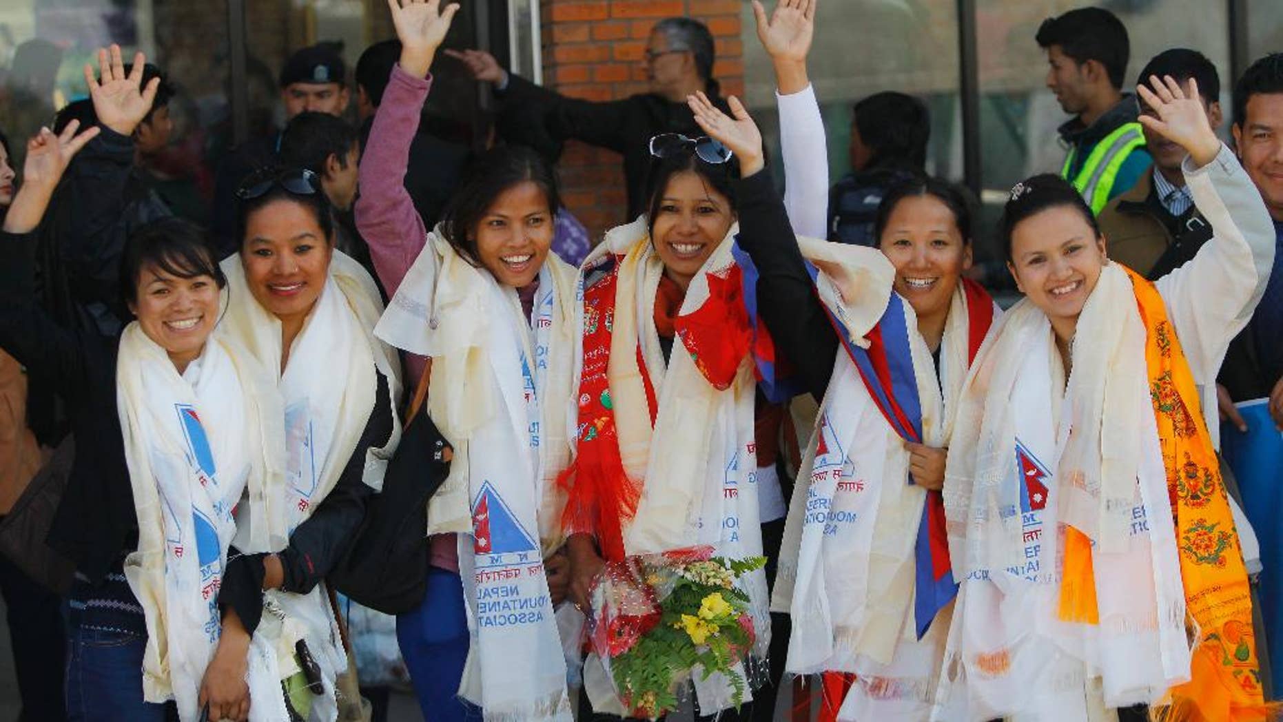 Jan. 9, 2015: From left to right: Nepalese climbers Nimdoma Sherpa, Maya Gurung, Asha Singh, Chunu Shrestha, Pema Dikki and Shailee Basnet pose for the media at the Tribhuwan International Airport, Kathmandu.