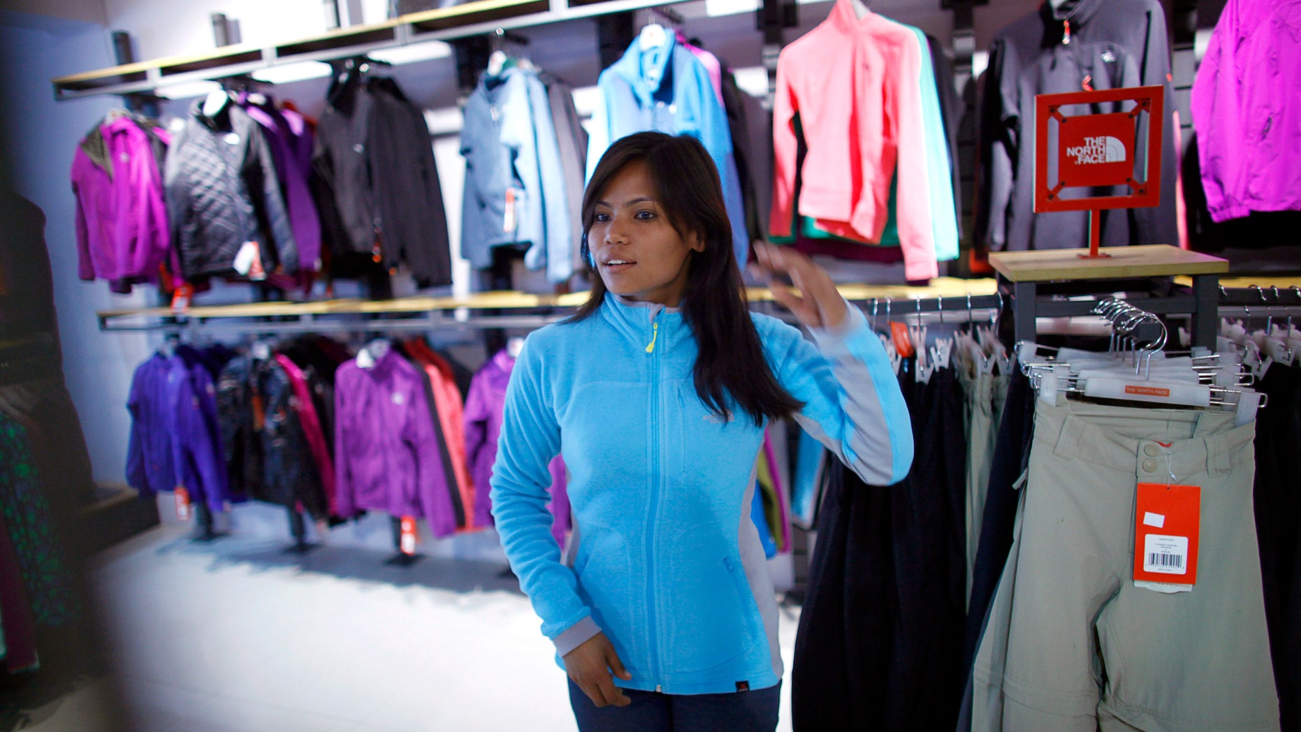 Feb. 21, 2013: Nepalese climber Asha Singh looks at climbing gear at a store in Katmandu, Nepal. Aiming to change the all-male image of mountaineering in the country, a group of Nepalese women have embarked on a mission to climb the tallest mountain on each of the seven continents.