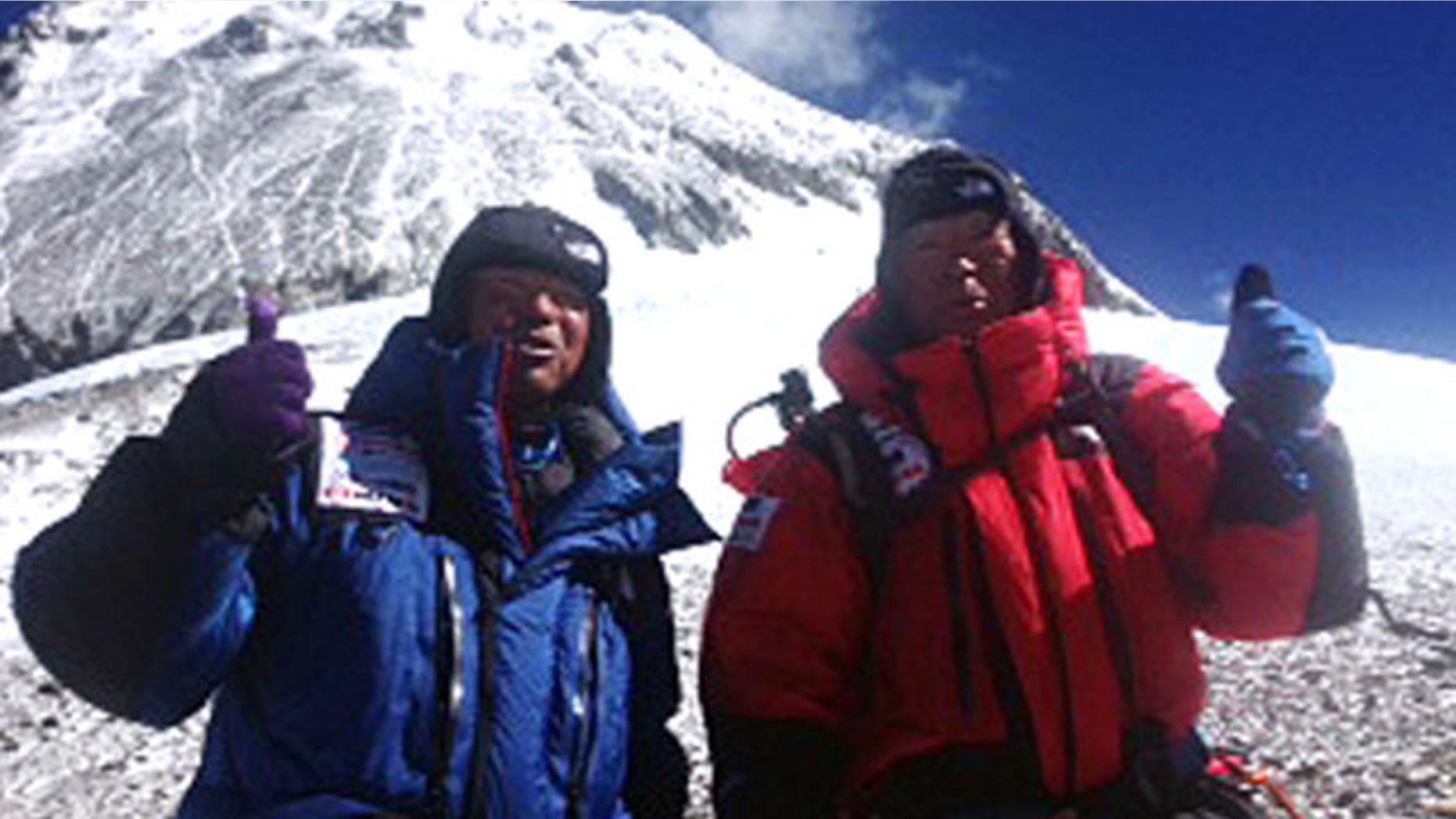 May 22, 2013: 80-year-old Japanese extreme skier Yuichiro Miura, right, and his son, Gota pose at their South Col camp at 26,247 feet before their departure for Camp 5 during their attempt to scale the summit of Mount Everest.
