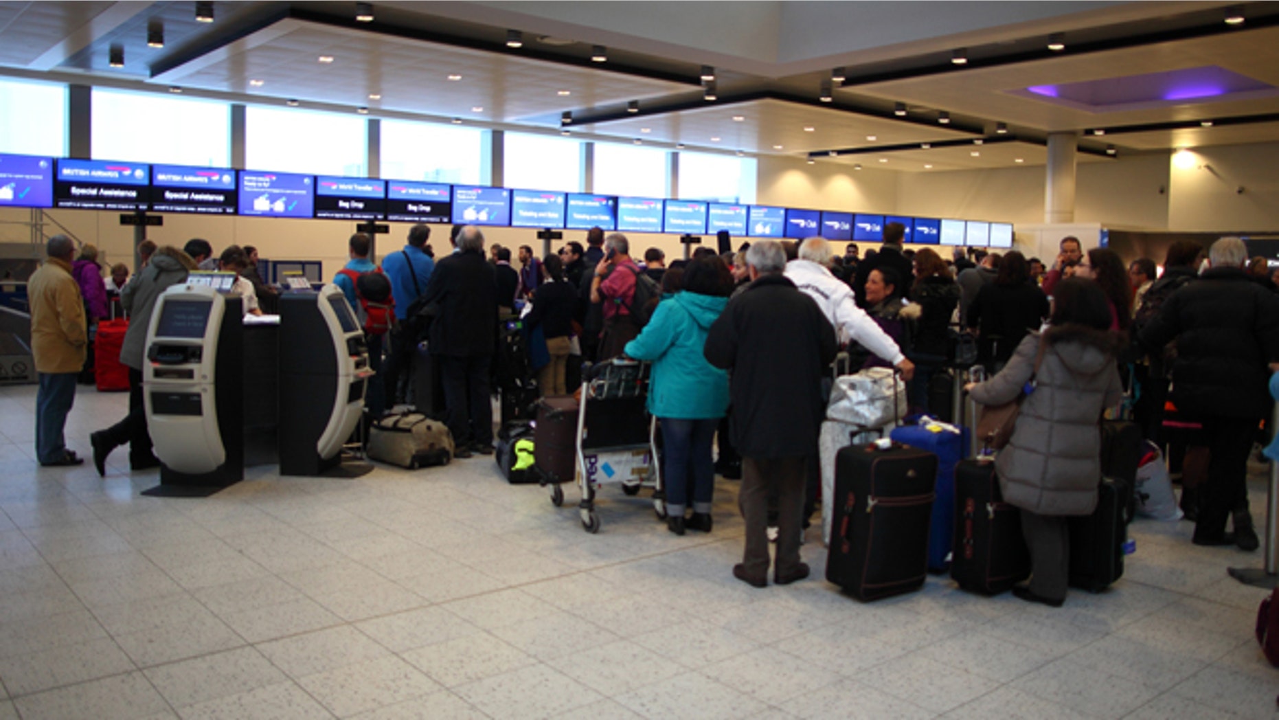 Delayed British Airways passengers wait in line at the check-in desk at Gatwick Airport's North Terminal on January 18, 2013 in London, United Kingdom. (Photo by Jordan Mansfield/Getty Images)