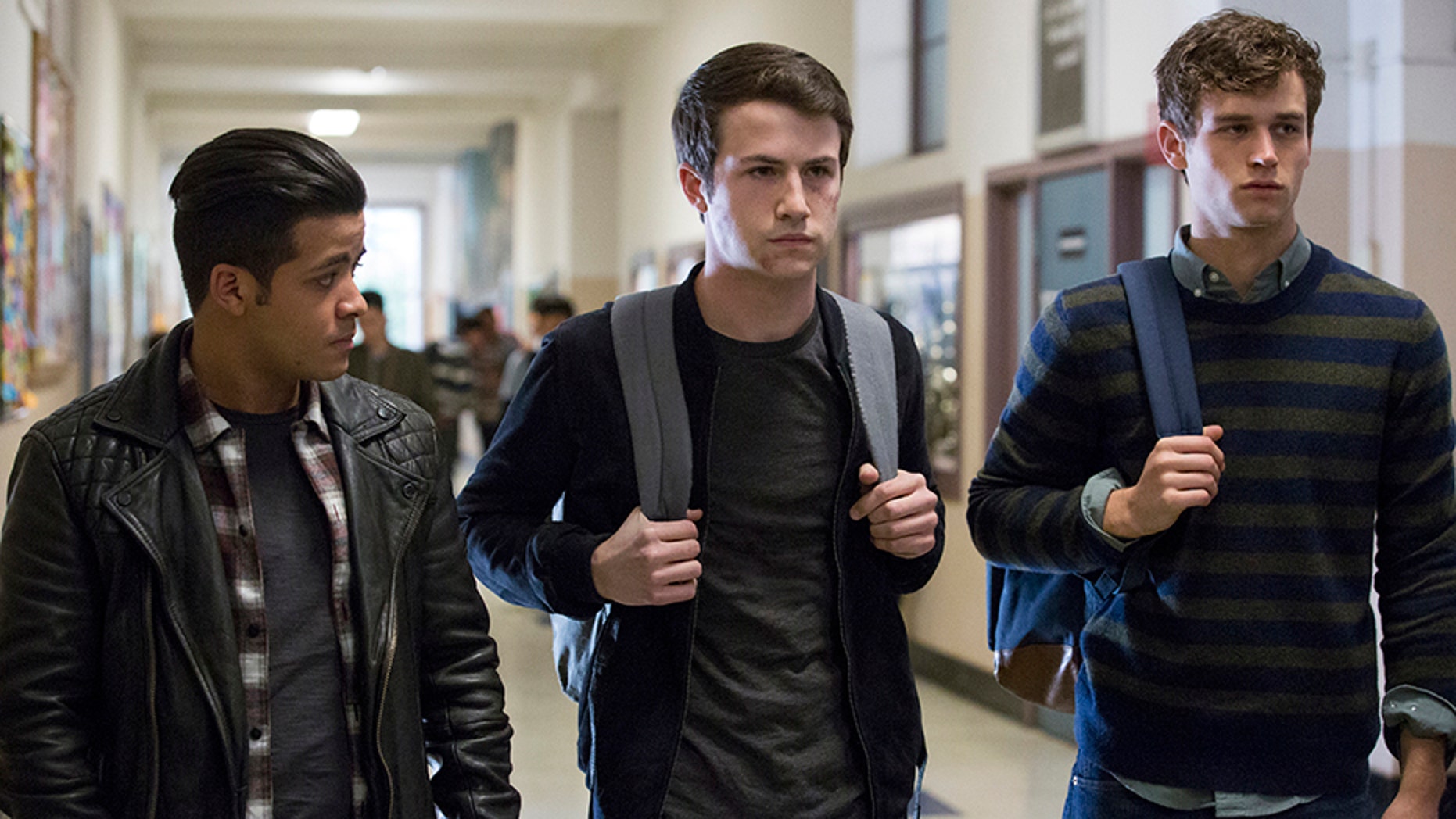 This image released by Netflix shows, from left, Christian Navarro, Dylan Minnette and Brandon Flynn in "13 Reasons Why."