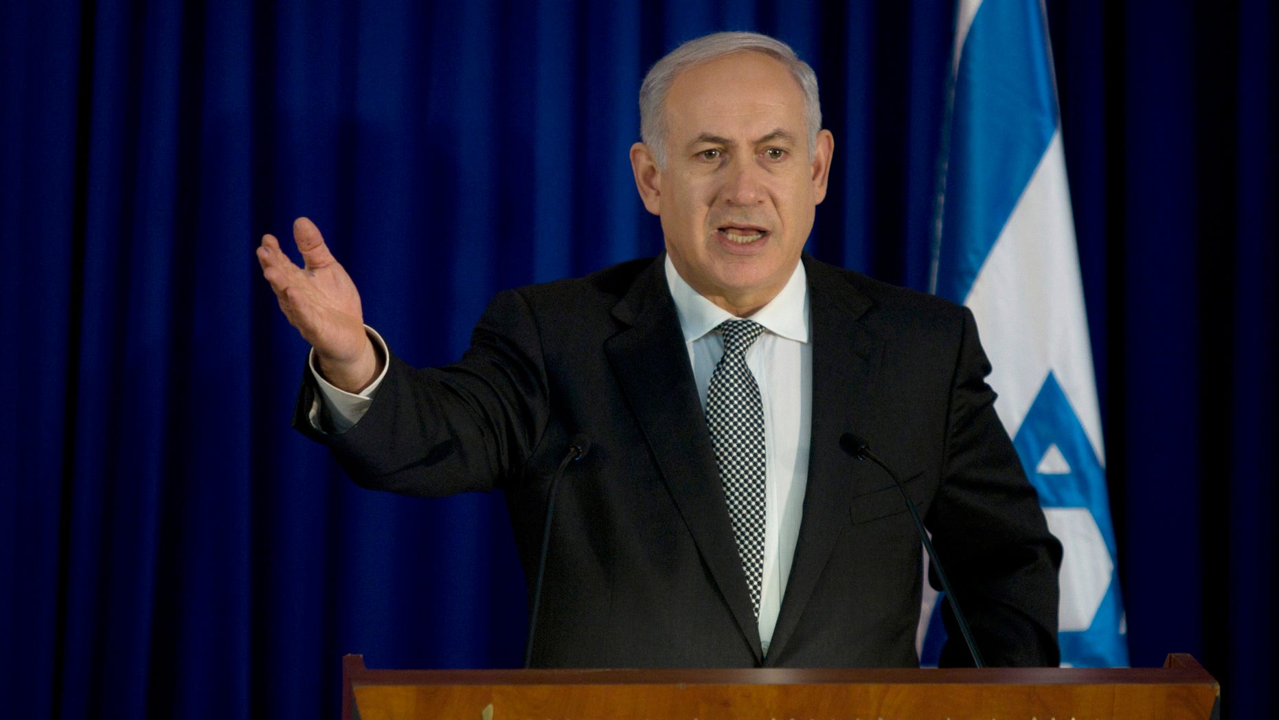 Jan. 31: Israeli Prime Minister Benjamin Netanyahu gestures as he speaks during a joint press conference with German Chancellor Angela Merkel, not seen, in the prime minister's office in Jerusalem. Netanyahu said Monday his country's primary concern is that the current crisis in Egypt could create a void in which Islamic militants step in and put the two countries' three-decade-long peace agreement in jeopardy. (AP)
