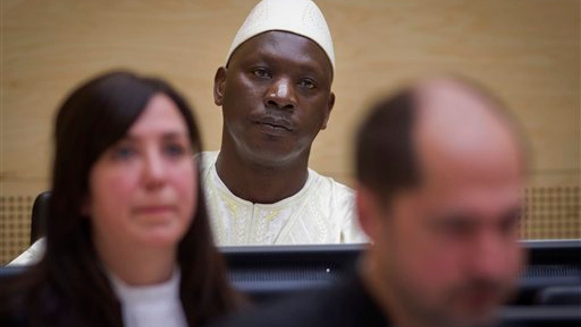 March 14, 2012: Congolese warlord Thomas Lubanga, center, awaits his verdict in the courtroom of the International Criminal Court (ICC) in The Hague, Netherlands.