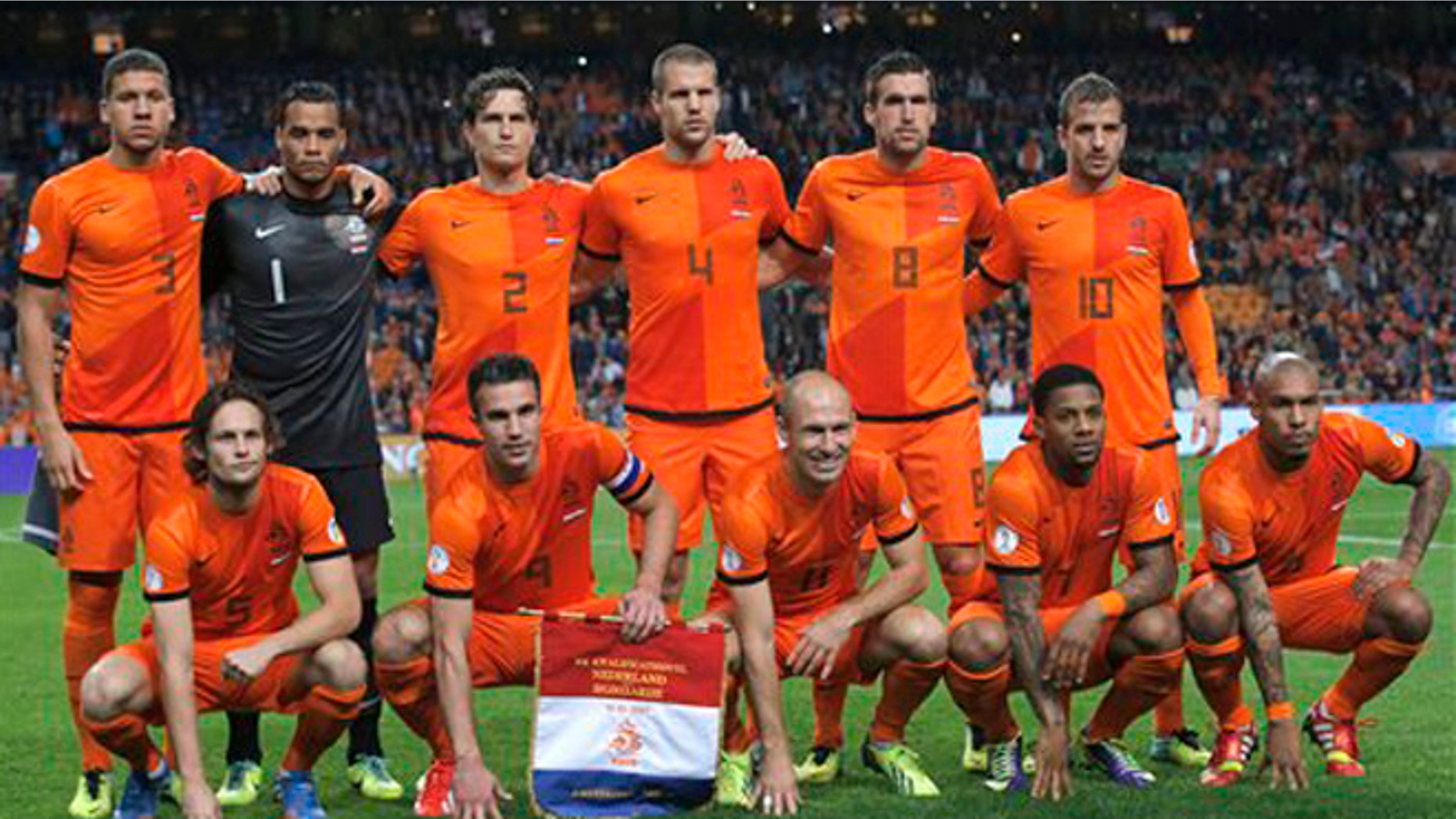 FILE - In this Oct. 11, 2013 file photo, Dutch soccer team poses prior the start the Group D World Cup qualifying soccer match between Netherlands and Hungary, at Arena stadium in Amsterdam, Netherlands. Background from left: Jeffrey Bruma, Michel Vorm, Daryl Janmaat, Ron Vlaar, Kevin Strootman, and Rafael van der Vaart. Foreground from left: Daley Blind, Robin van Persie, Arjen Robben, Jeremain Lens and Nigel de Jong. (AP Photo/Peter Dejong, File) - SEE FURTHER WORLD CUP CONTENT AT APIMAGES.COM