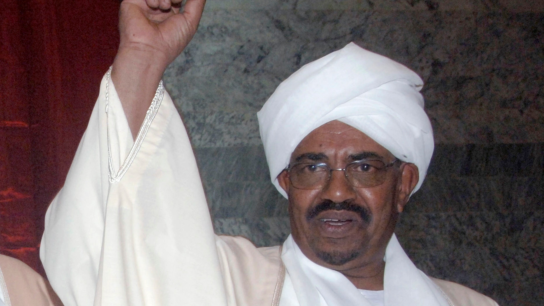 May 27: Sudan's president Omar al-Bashir gestures prior to being sworn in, at the parliament in Khartoum, Sudan. (AP)