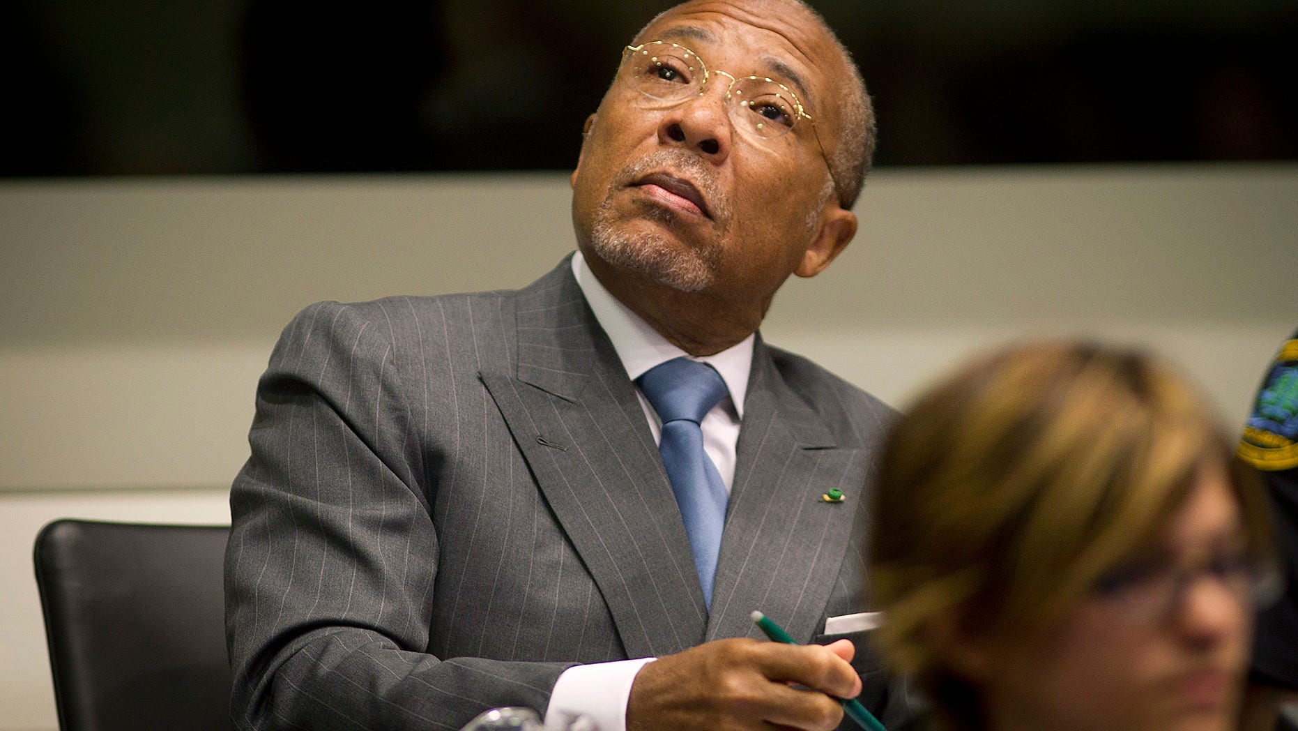 May 16, 2012: Former Liberian President Charles Taylor looks up to the public gallery as he waits for the start of his sentencing hearing in Leidschendam, near The Hague, Netherlands.