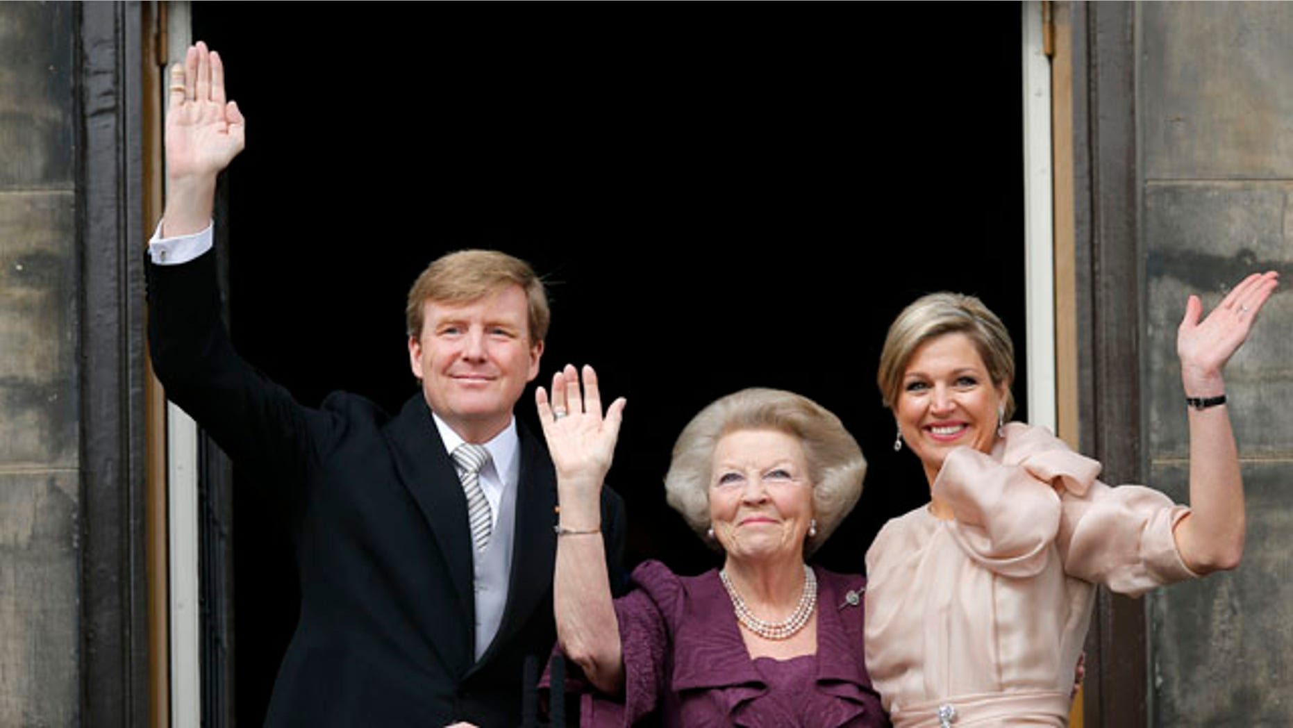 April 30, 2013: Dutch King Willem-Alexander, Queen Maxima, right, and Princess Beatrix appear on the balcony of the Royal Palace in Amsterdam, The Netherlands.