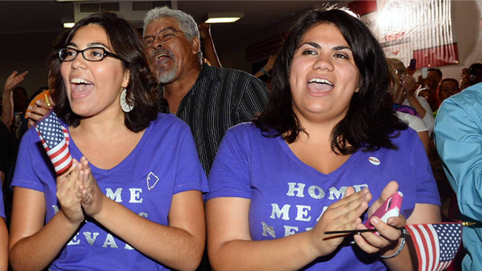 Blanca Gamez (L) and Astrid Silva, both from Nevada, cheer at an immigration reform event at the offices of the Culinary Workers Union Local 226. (Photo by Ethan Miller/Getty Images)