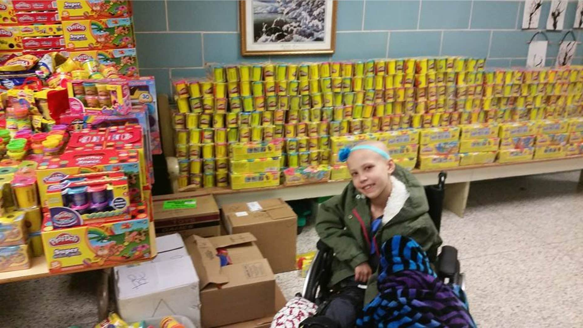 Nevaeh Griffin pictured with Play Doh donated as part of her campaign to give back to other children fighting cancer.