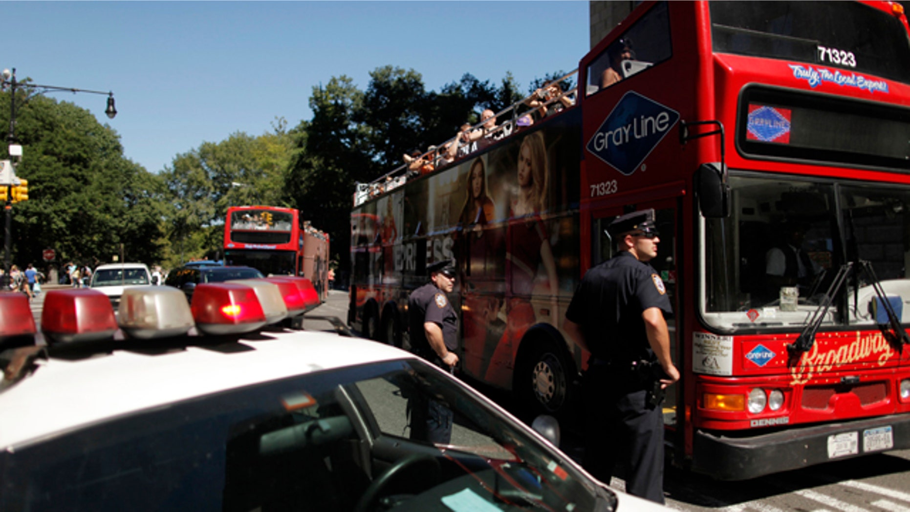 Sept. 9, 2011: New York Police Department officers watch as a tour bus drives past a security checkpoint leading into midtown Manhattan in New York.
