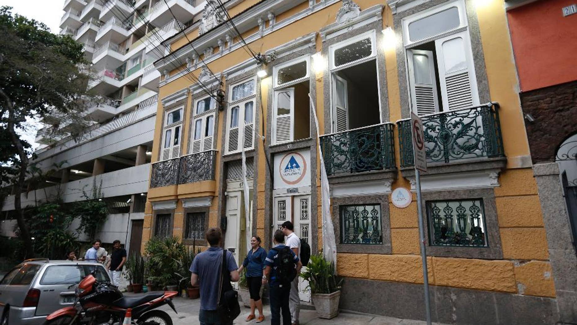 FILE - This Nov. 12, 2014, file photo shows the Cidade Maravilhosa Hostel where New Zealand citizen Phillip John Smith was arrested by federal police in Rio de Janeiro, Brazil. The convicted murderer and child molester was able to flee to Brazil while on temporary release from prison because staff didn’t contact the man he was supposed to stay with and border officials didn’t have a comprehensive system to identify criminals, according to a New Zealand government report released Thursday, Oct. 1, 2015.(AP Photo/Silvia Izquierdo, File)