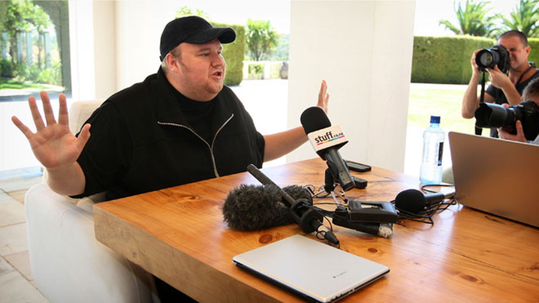 Jan. 20, 2013: Indicted Megaupload founder Kim Dotcom holds a press conference ahead of the launch of a new file-sharing website called "Mega" at his Coatesville mansion in Auckland, New Zealand.