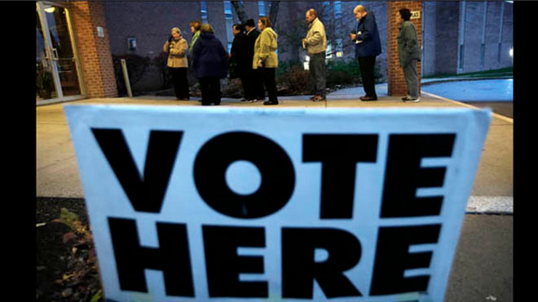 Nov. 6, 2012: Voters wait in line for the doors to Precinct 39 to open before casting their ballots on Election Day.