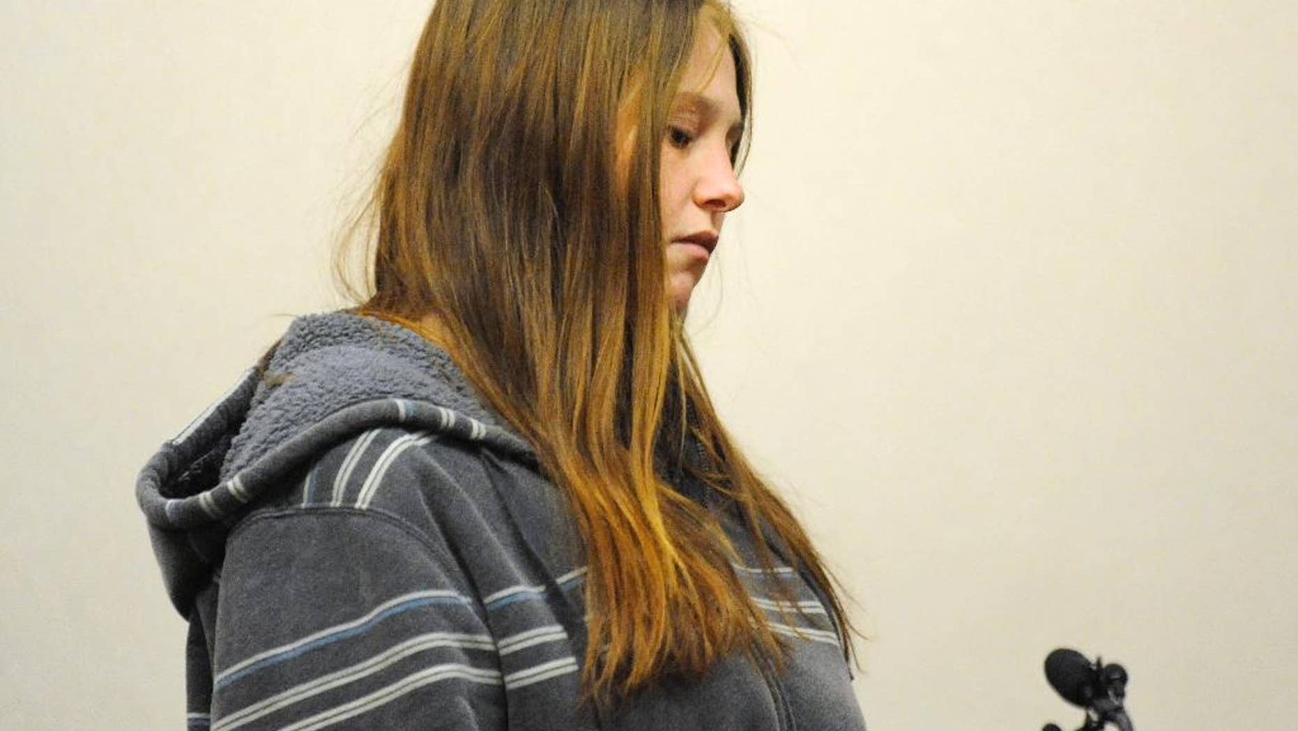 Angela Alexie is arraigned in court in Eastpointe, Mich., on Wednesday, Jan. 28, 2015. Alexie, whose newborn baby was found dead at a Detroit-area recycling center after she gave birth in a garage, was charged Wednesday with murder and child abuse. Investigators say the 24-year-old Alexie disclosed that she gave birth alone in a garage in Eastpointe on Dec. 22, and the baby was left there to die a few days later. The body ended up at a recycling center in nearby Roseville where workers discovered it on Jan. 14. (AP Photo/The Detroit News, David Coates)